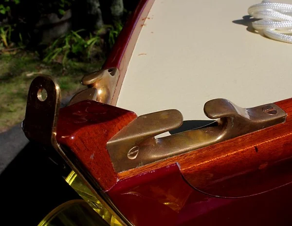 Bronze bow hardware. Note that the wale board is let into a recess in the carbon topsides.