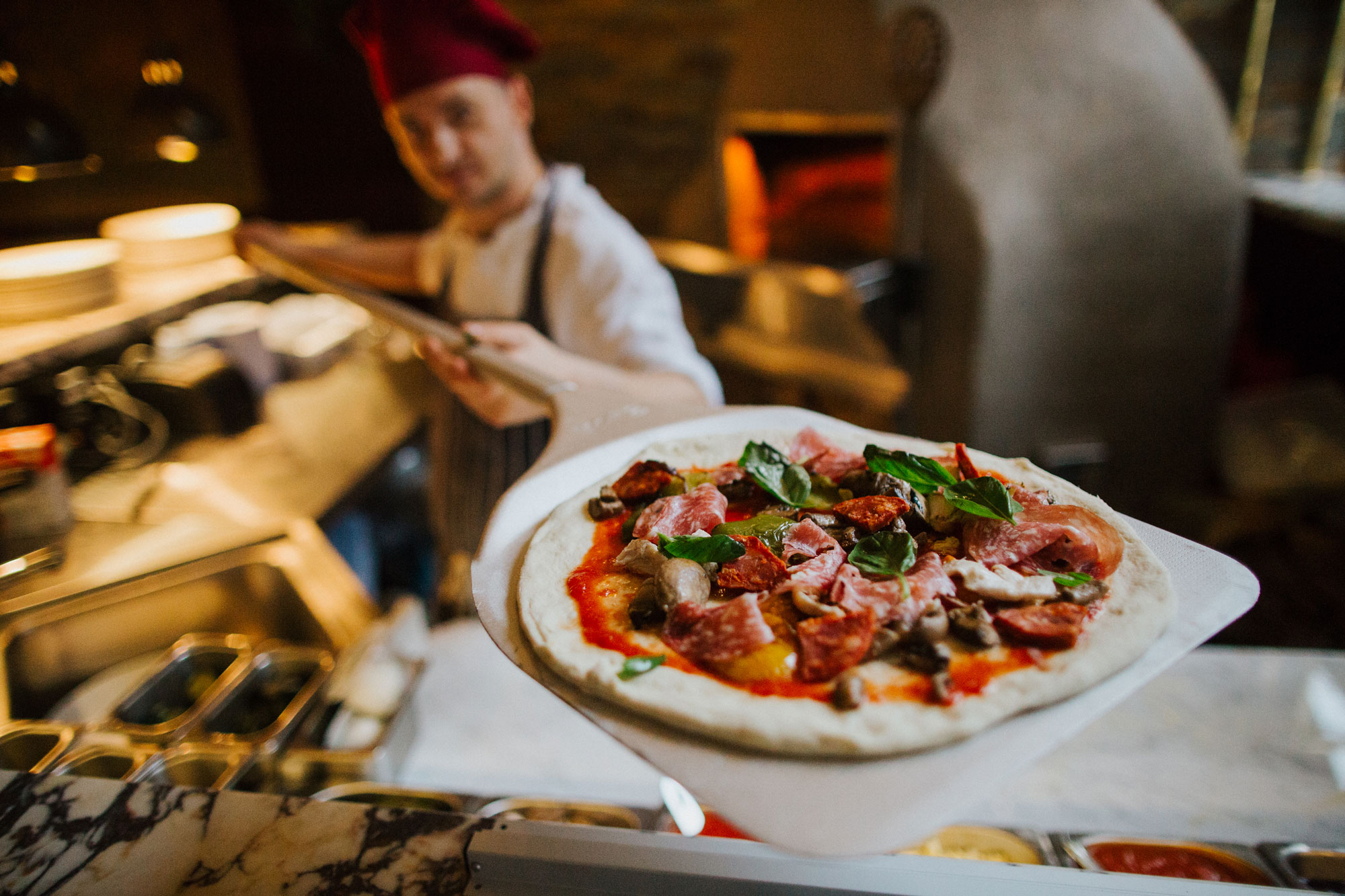 Pizzaiolo with wood-fired pizza at The Globe pub, restaurant and hotel in Warwick.jpg