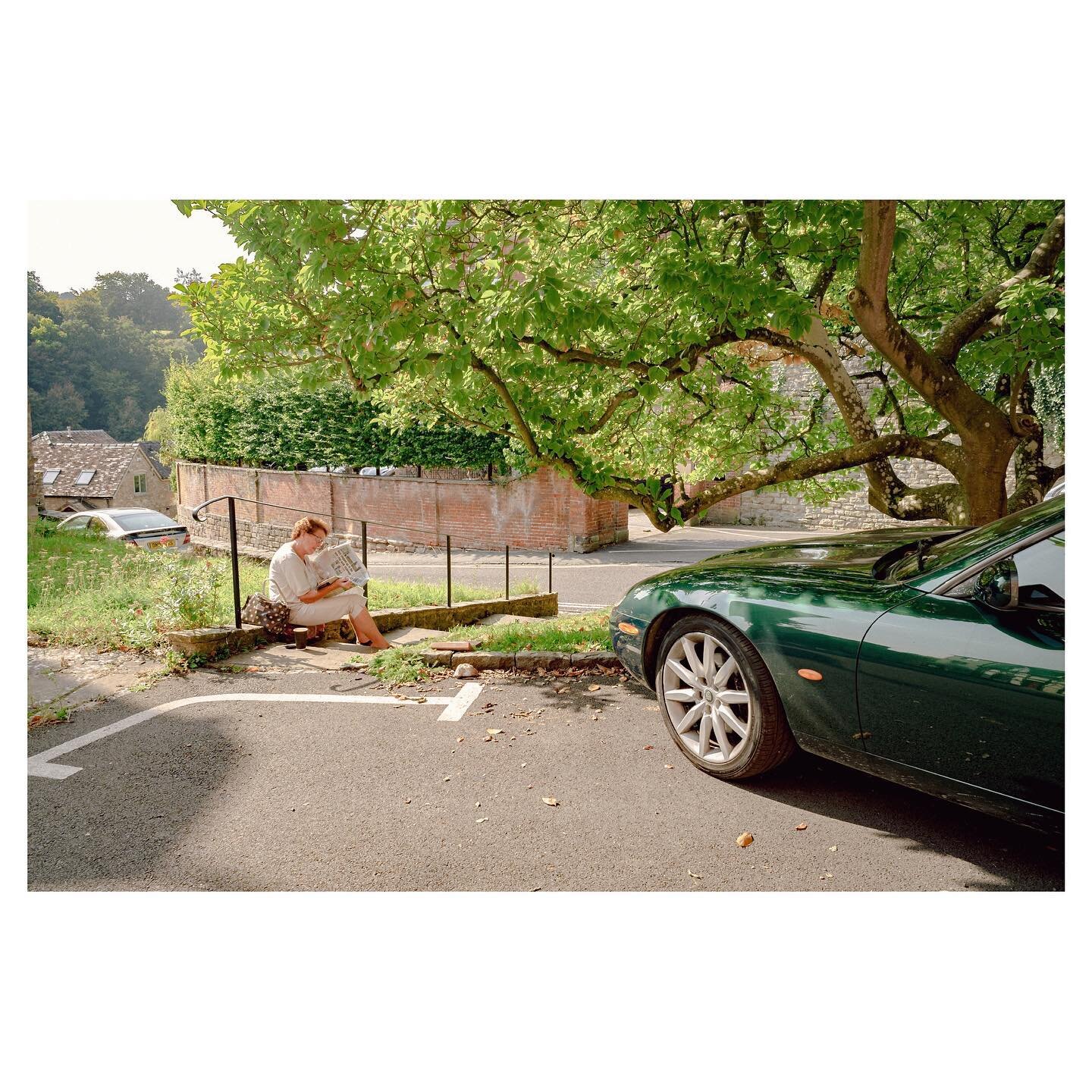 A quiet read under the tree. 
(Really liked the green Jag parked next to her as well) 
Another image from last weeks holiday, this time from the beautiful market town of Ludlow, Shropshire.