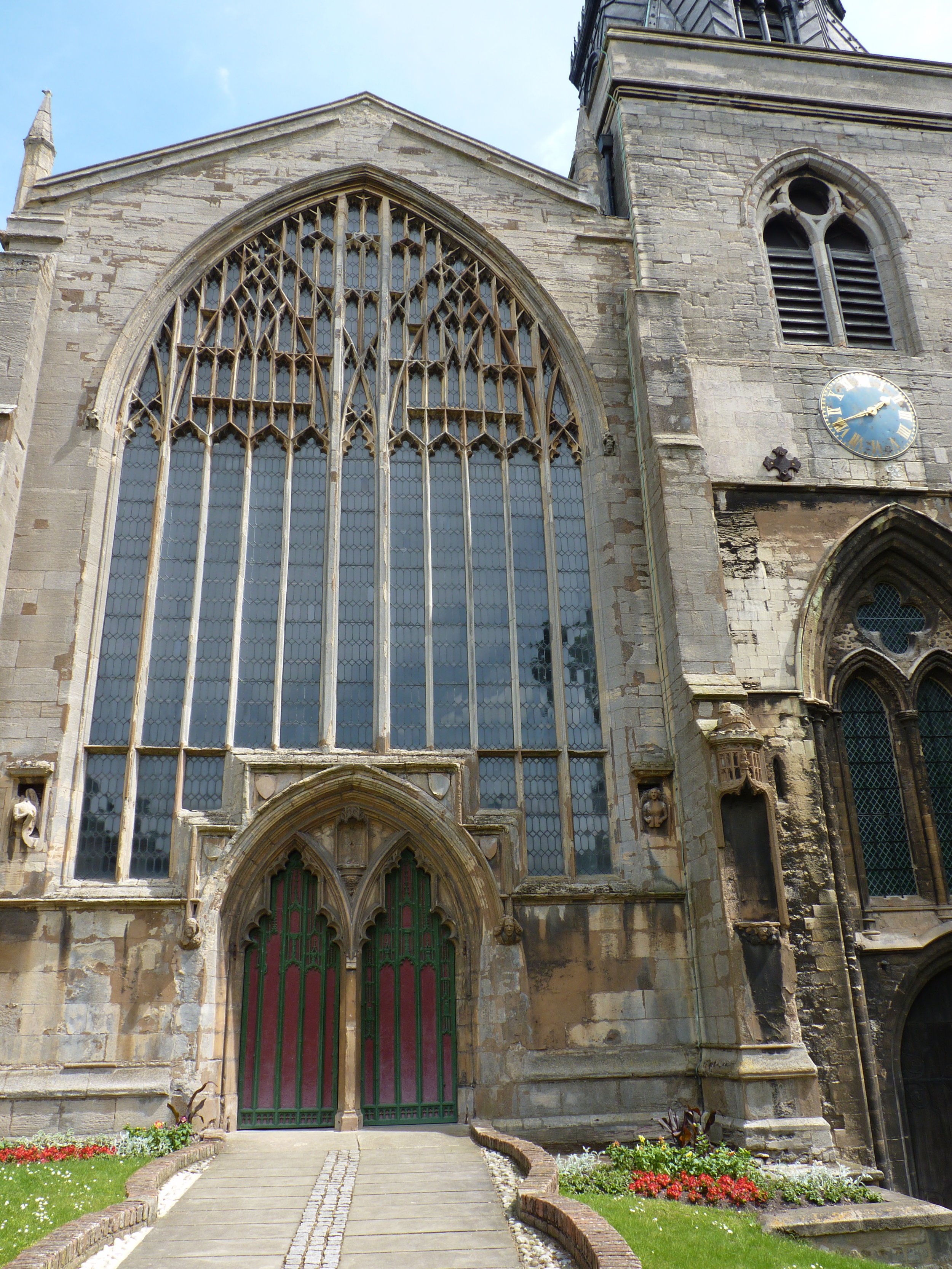 The facade of St Nicholas with its magnificent west window tracery