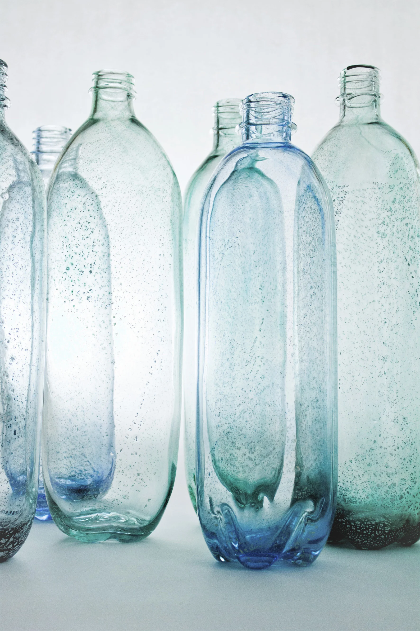 Stewart Hearn’s large glass bottles are intentionally reminiscent of archaeological finds, being based on Roman and medieval glass dredged from the River Thames. These bottles were originally made for a Thames River Festival but have become an ongoing series.