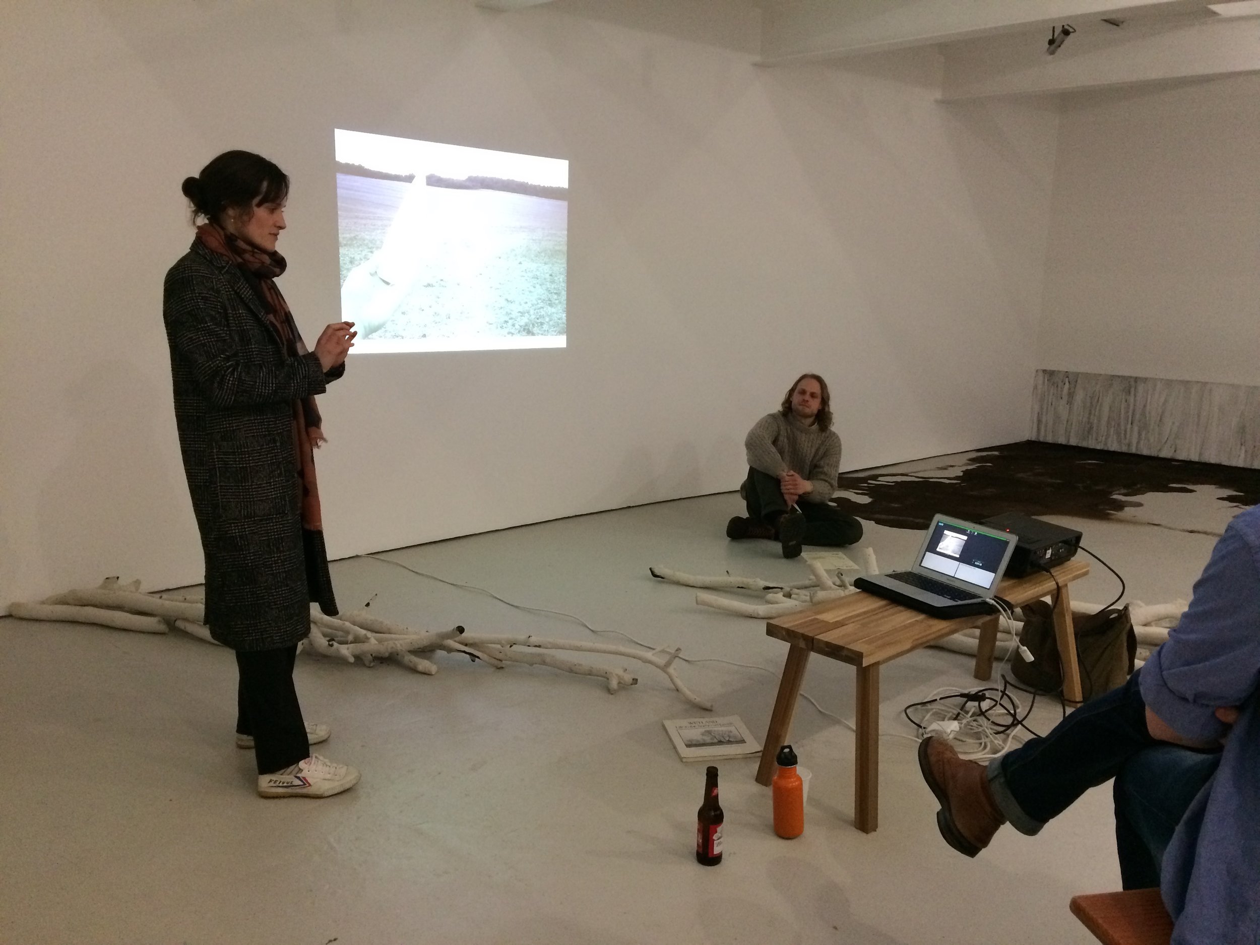 Lotte Scott giving a talk in her exhibition ‘The Fields Are Seas’ at Norwich Outpost Gallery, 2018.