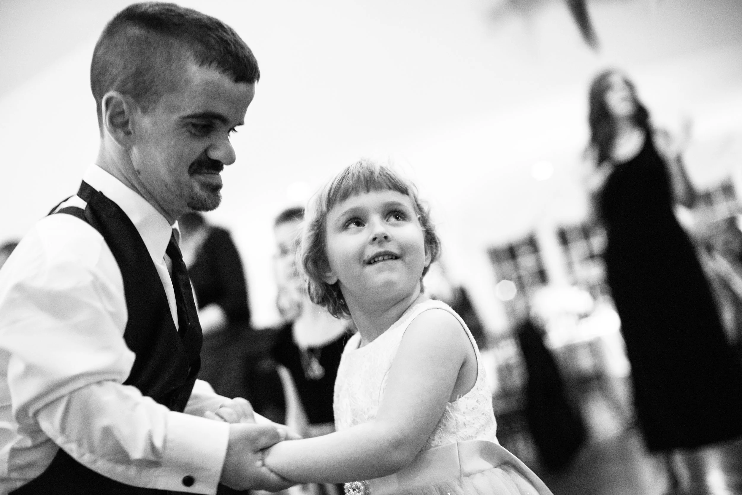 Groom dancing with his daughter