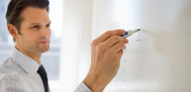 Man%20with%20whiteboard_hmpg_web_jpg.jpg