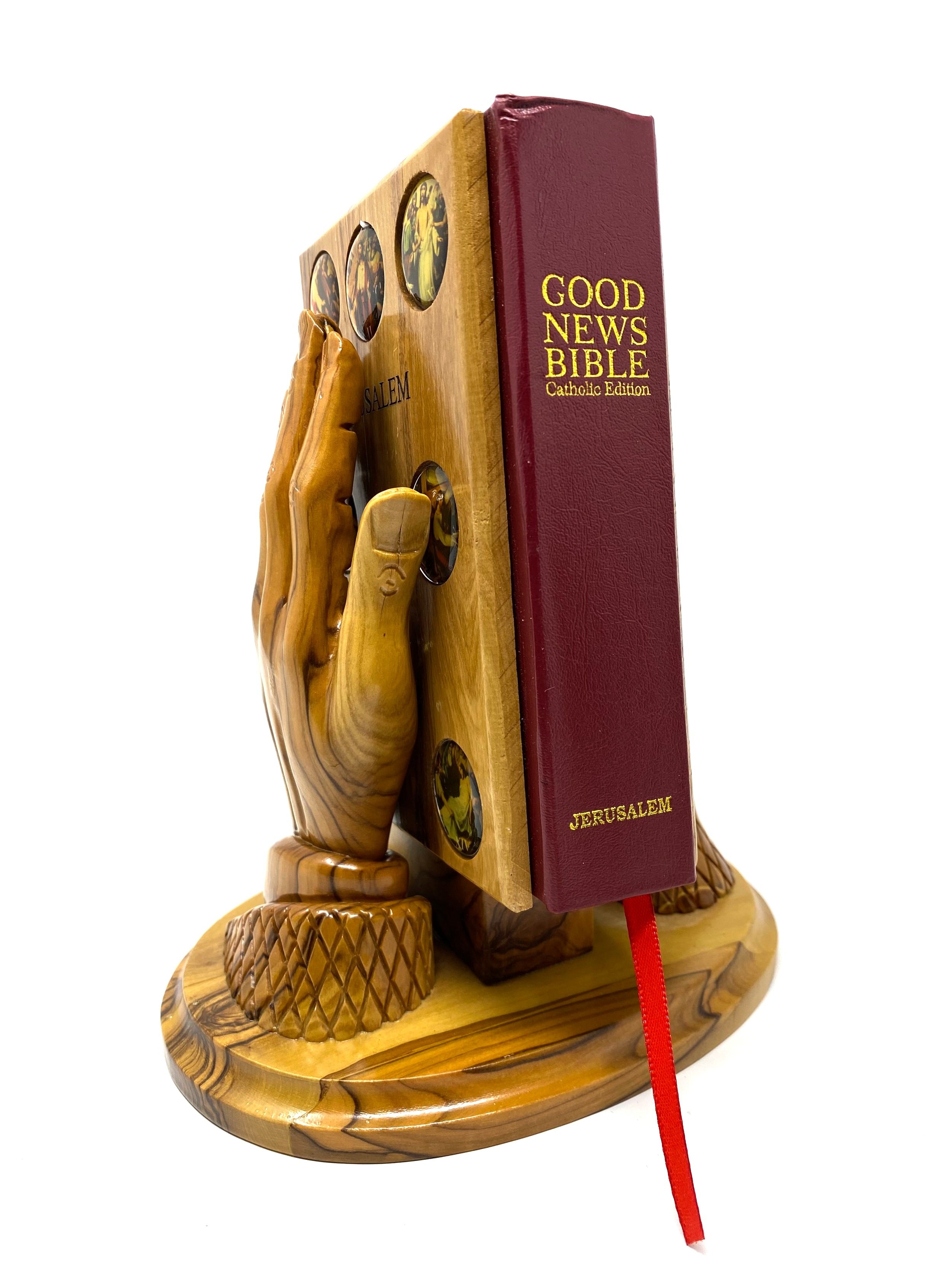 Catholic Bible with holder praying hands 