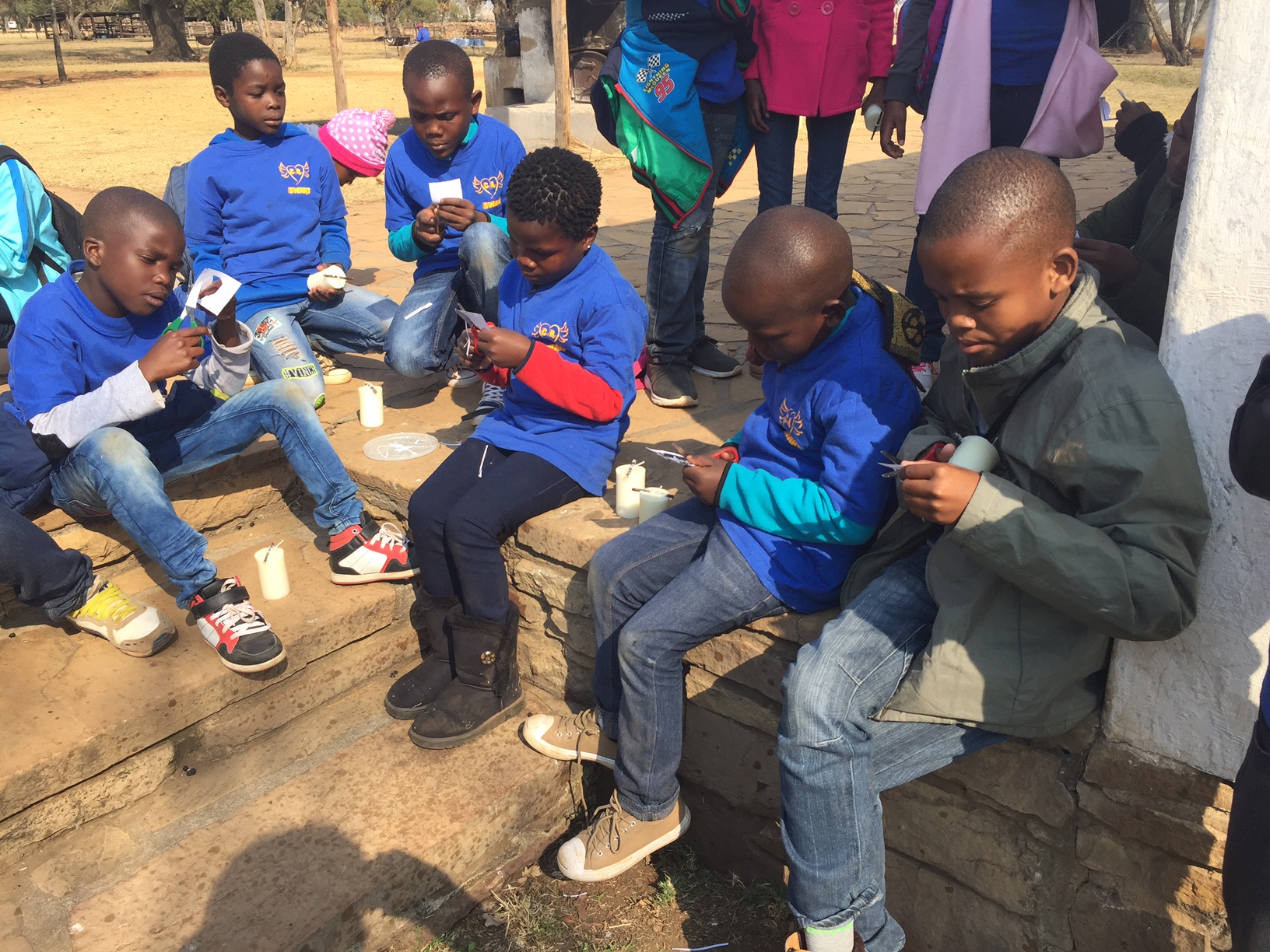 Children decorating candles on outing.JPG