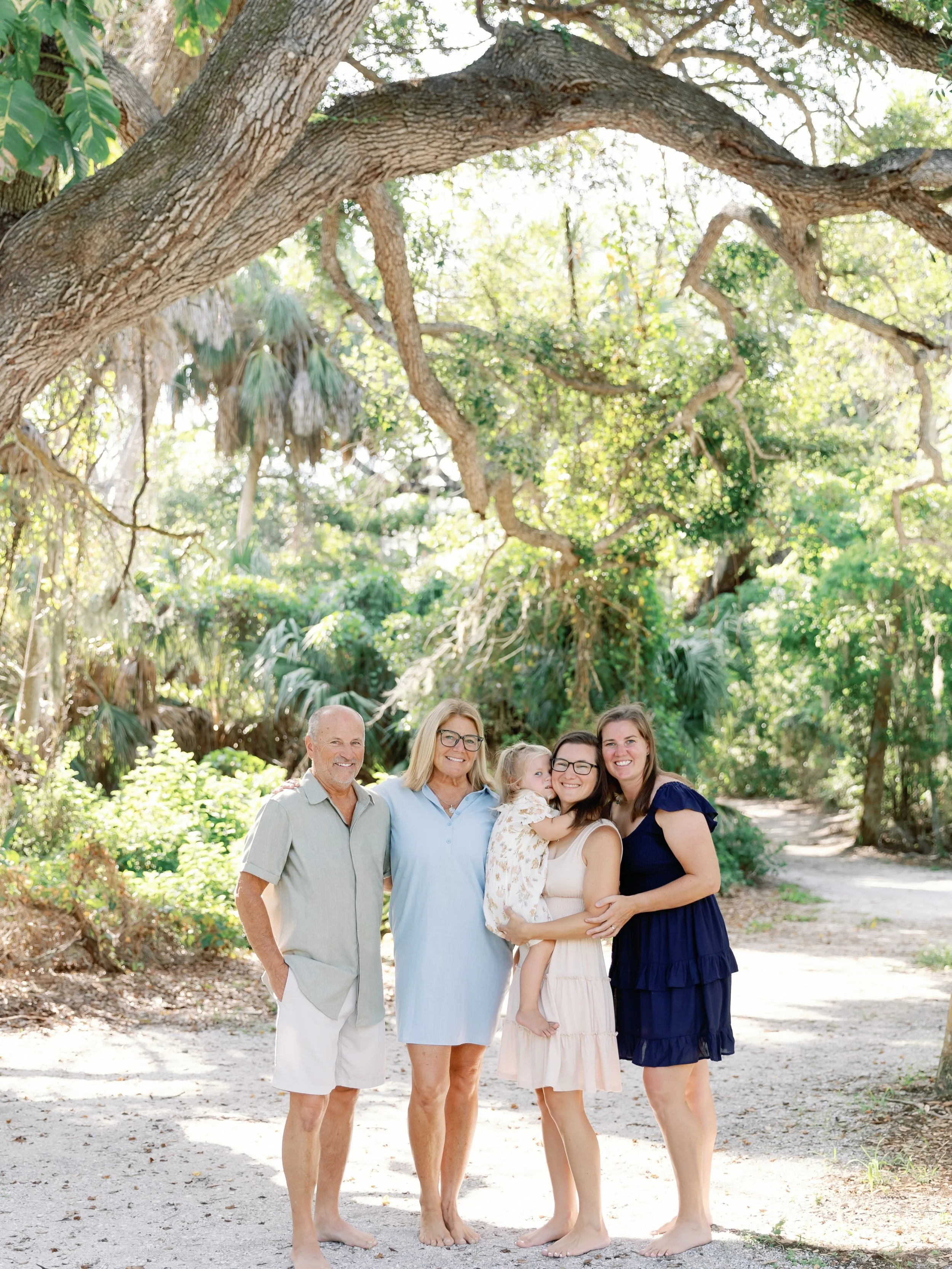 Spent a very sweet morning barefoot under the oak hammocks for this multi generational session. First time meeting this family and they are just the kindest humans. So much love between the grandparents, parents and this sweet girl ❤️