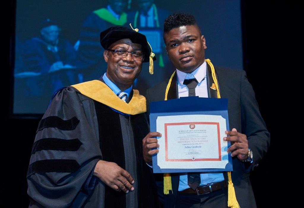 Receiving the Dr. Taen-Yu Dai Memorial Award from Dr. Sunmonu, Chair of the Mathematics and Computer Science department at the 2017 York College Honor Recognition Ceremony.
