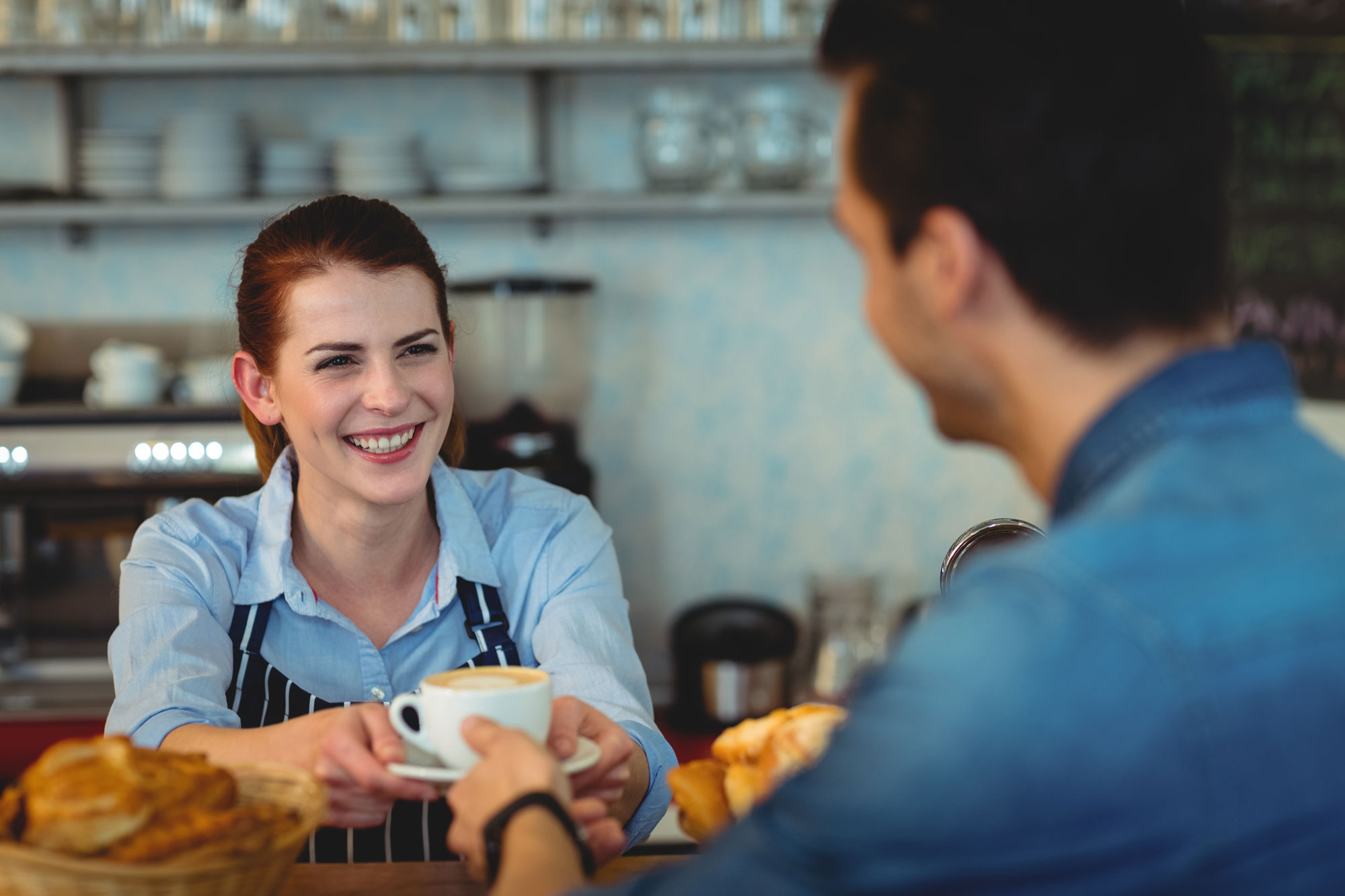bigstock-Cheerful-female-barista-giving-138430922WEB.jpg