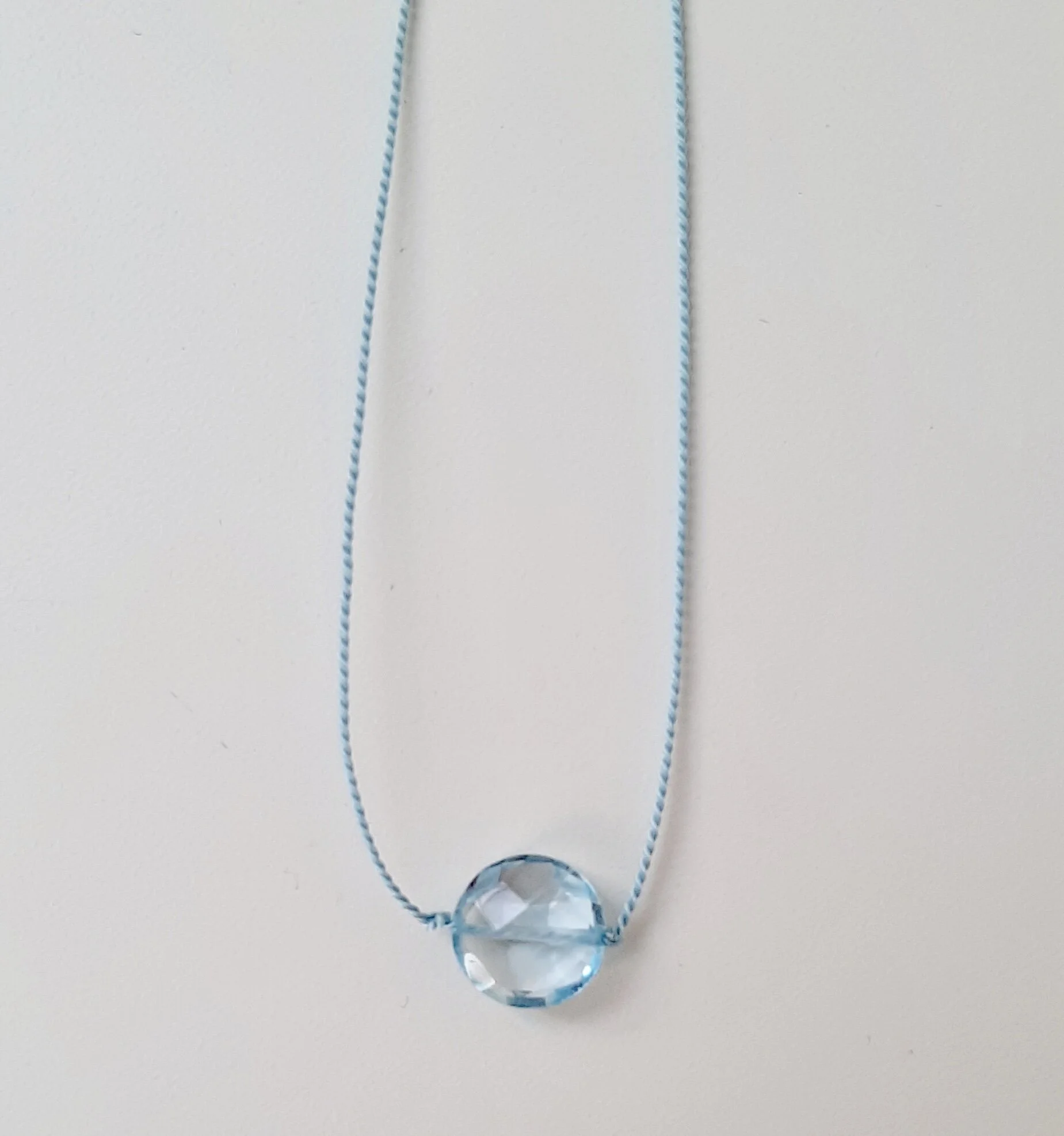 Sky blue topaz circle necklace