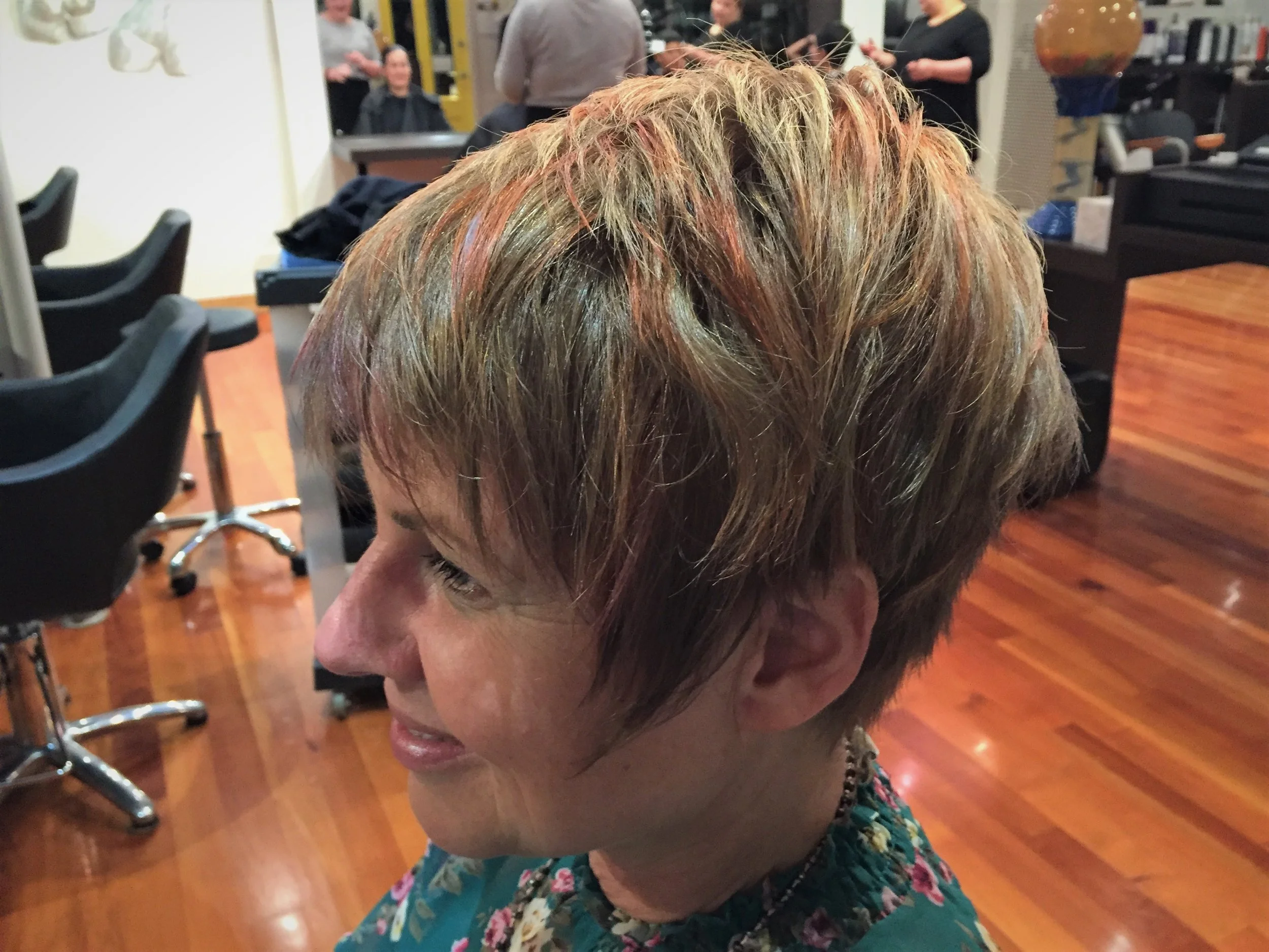 "Pops" of color in a face framing pixie - Colour & cut by David