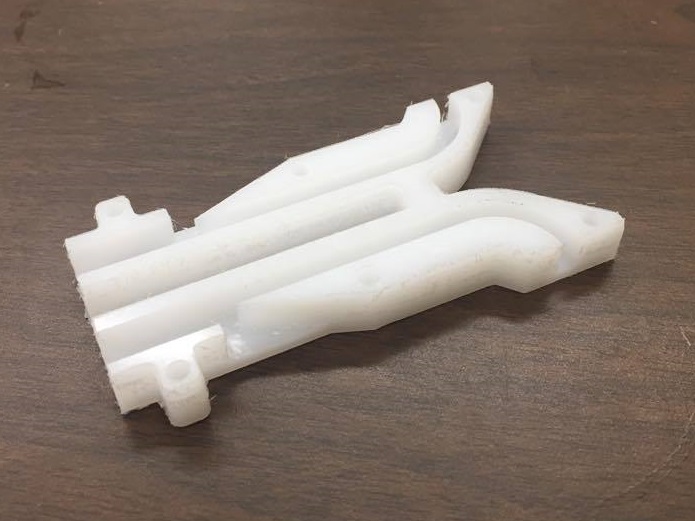 Whistle halves still connected after milling operation.