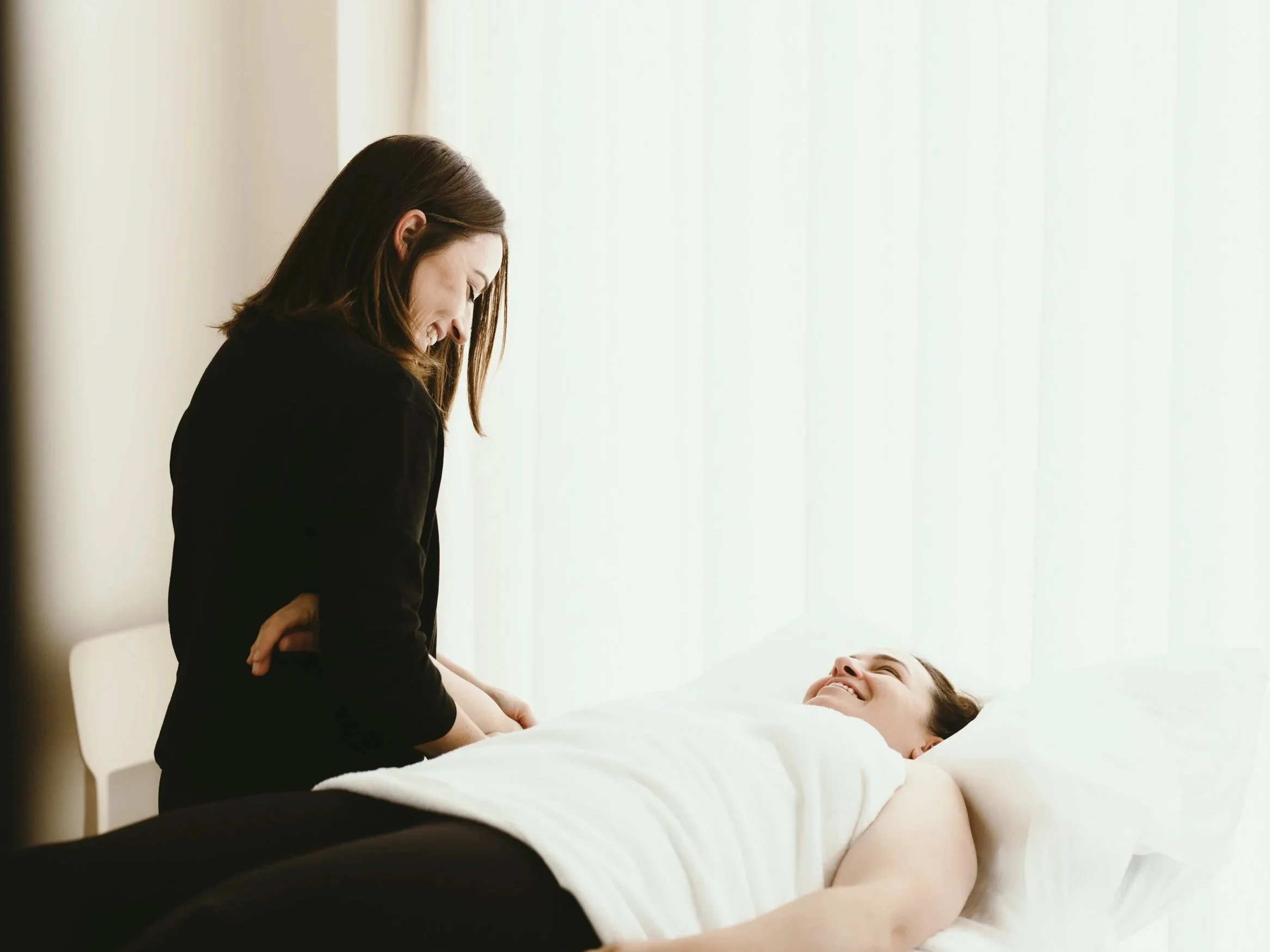 Body Lab practitioner providing hands-on treatment during a physiotherapy session