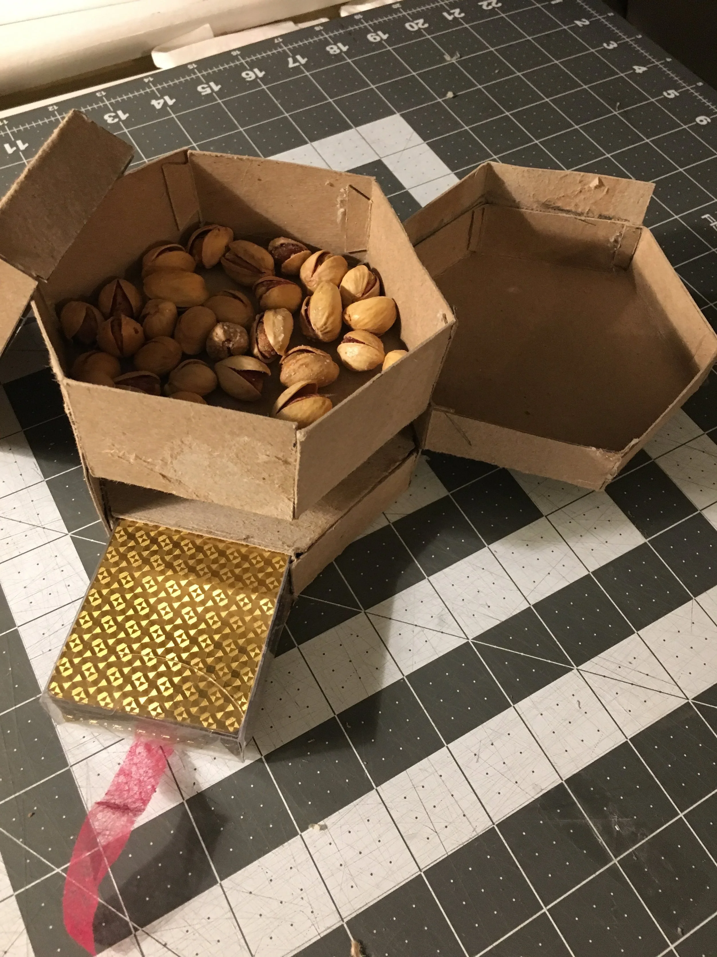 I then added a swing out compartment for the empty kernels since the previous design of splitting the top compartment in half left users with limited amount of pistachios. With the swing out, the top compartment can now hold even more pistachios.