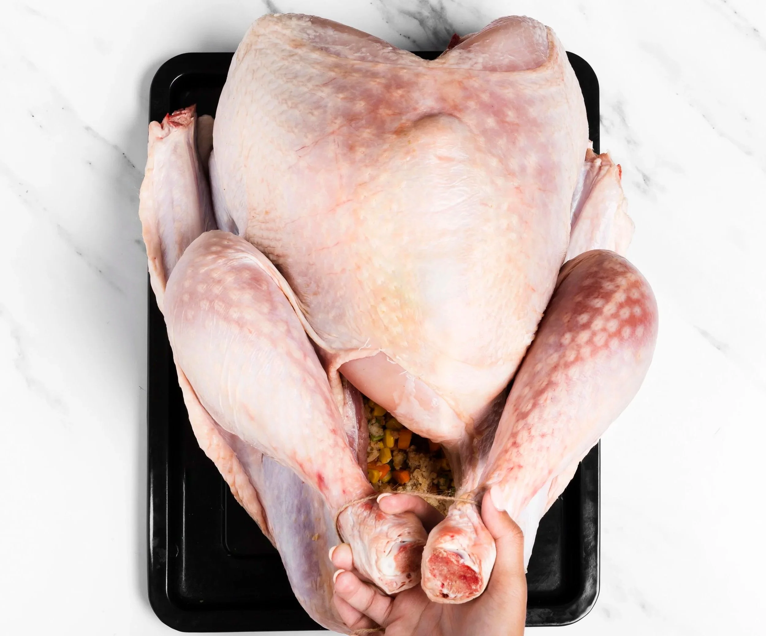 close-up-hands-holding-turkey-s-legs.jpg