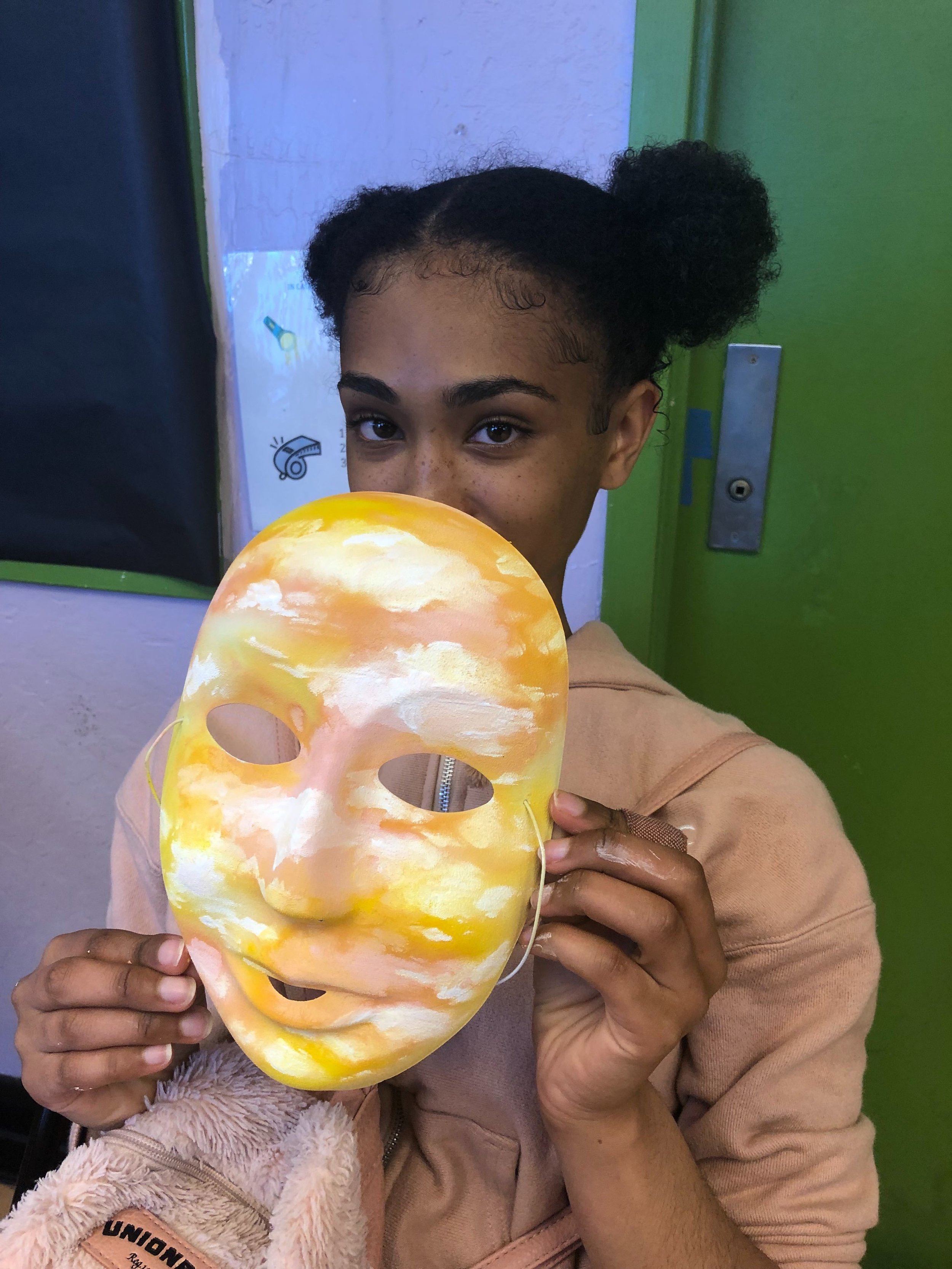 Aaliyah paints in RYSE's "Body Love" workshop