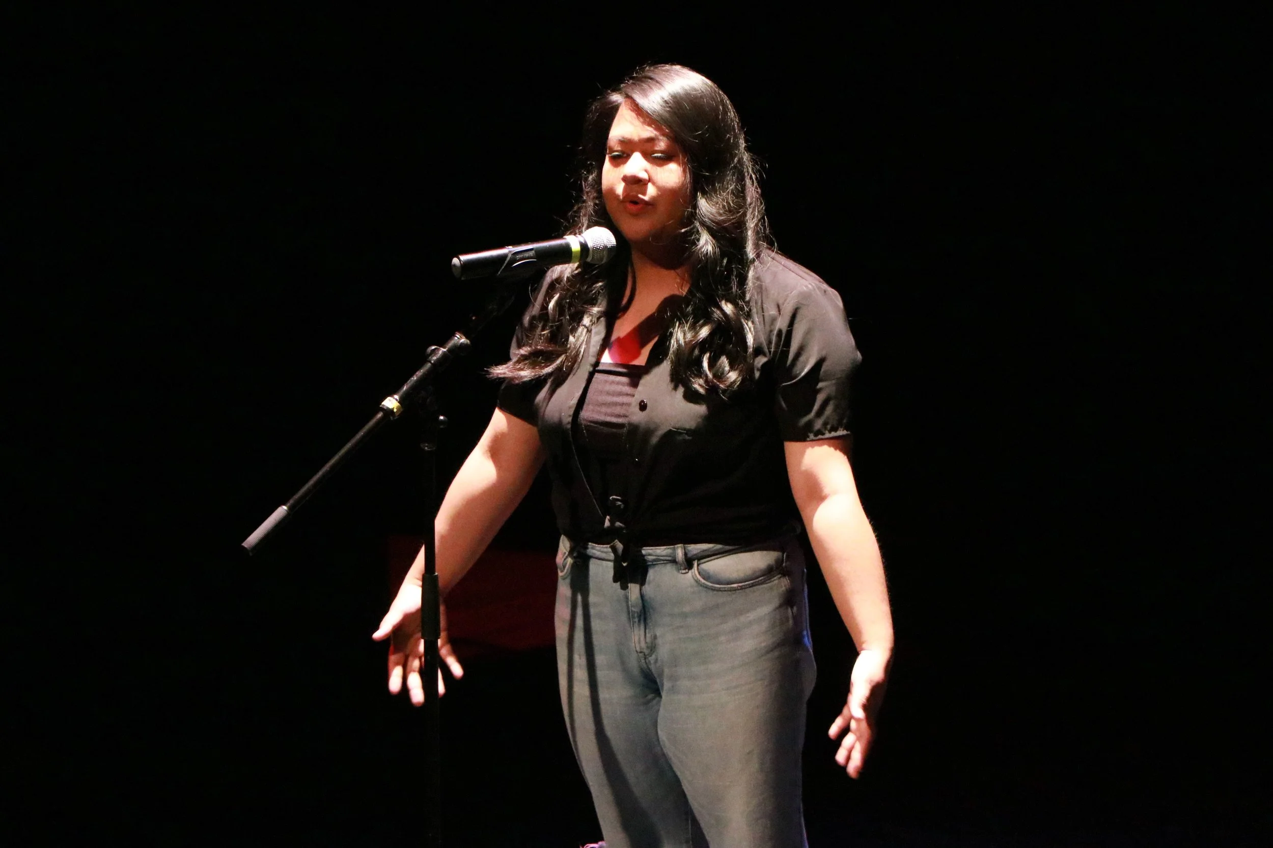 Poet and youth organizing intern Ann reciting a poem at our 2019 multimedia showcase, “Youthtopia: In the Face of Gentrification. On Friday, Ann will be sharing about what the new RYSE Commons means to her.