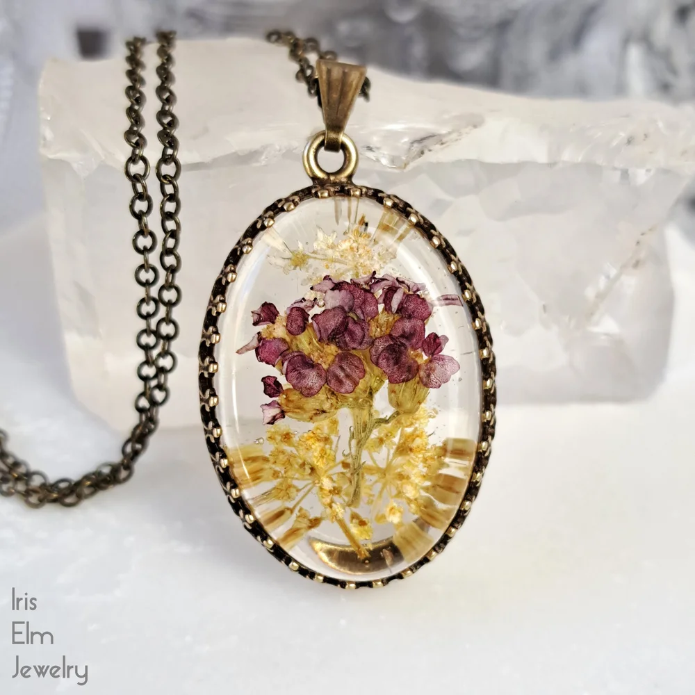 Small Oval Red, Yellow, and White Wildflower Resin Pendant - Main Image