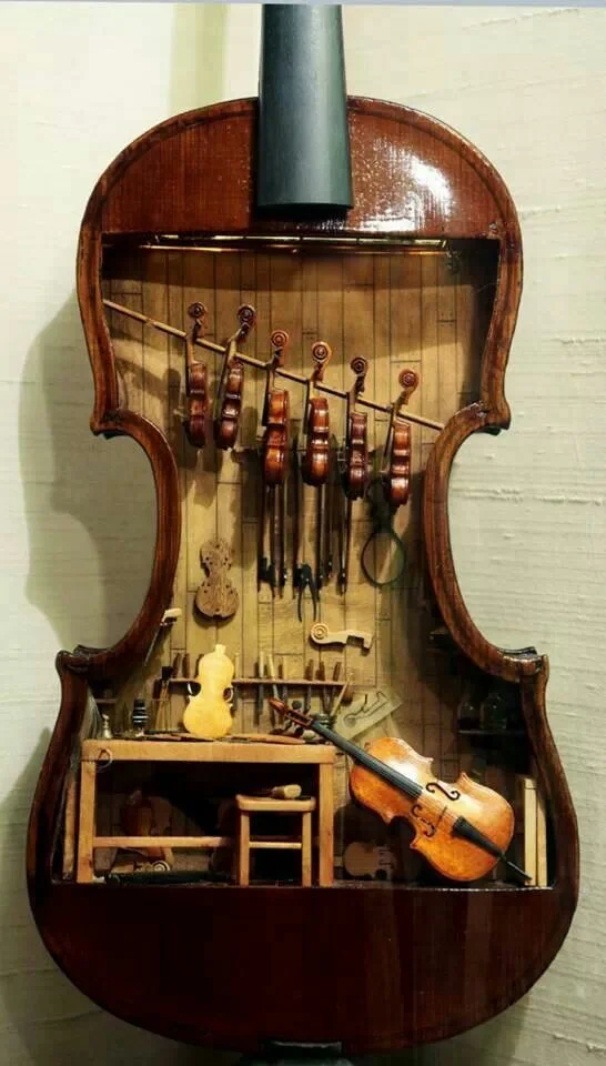 A miniature violin maker’s workshop in an old open violin. A work of love. Source: Unknown
