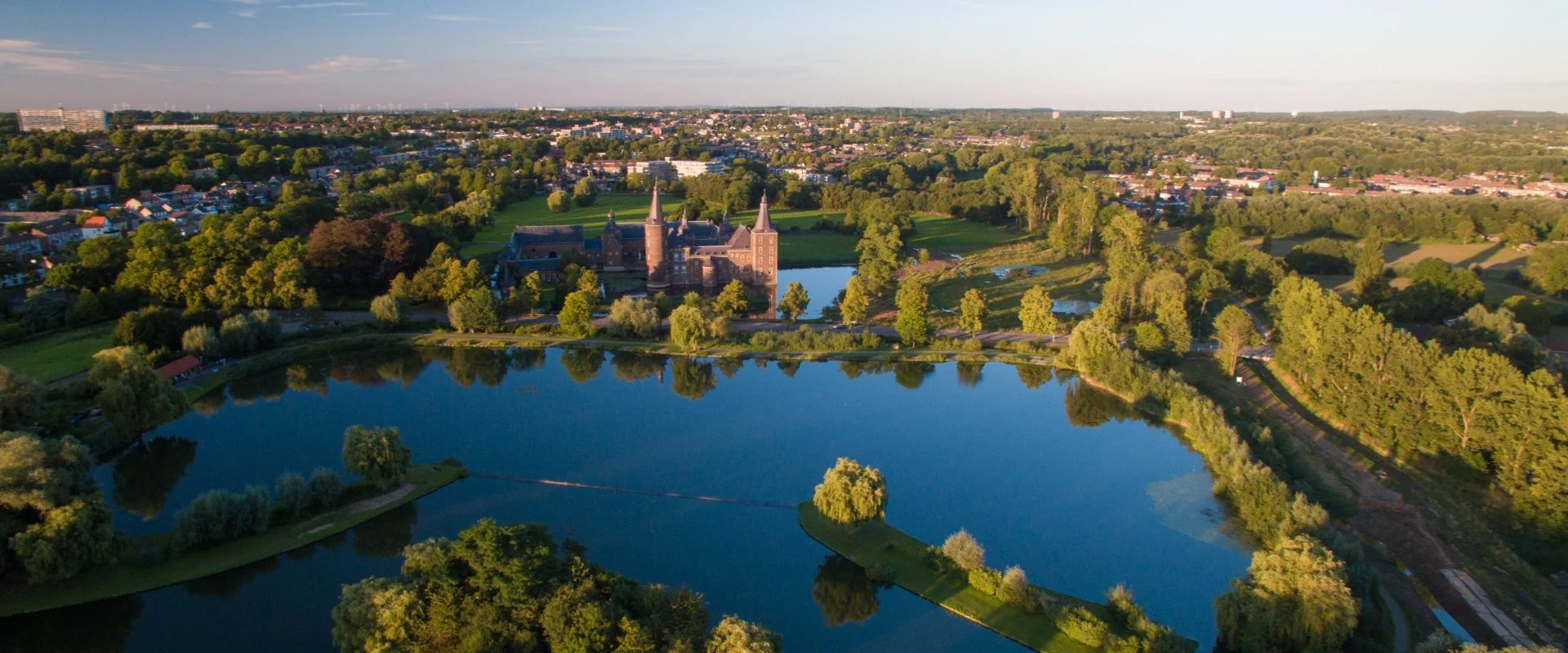 A bird’s eye view of Hoensbroek, the town I grew up in. In the foreground is the pond where we would go skating in wintertime. The castle, Kasteel Hoensbroek, is now a cultural center and restaurant where my family and I celebrated my father’s life after his funeral. In the upper left corner two high rises are visible. These were not around when I was young. It was a wooded area at the time and our house was just a block away. Such a beautiful place at that time. Source: Kasteel Hoensbroek