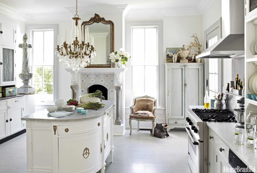 Traditional kitchen with fireplace! A tad too traditional for me, inviting nevertheless. Source: House & Beautiful.