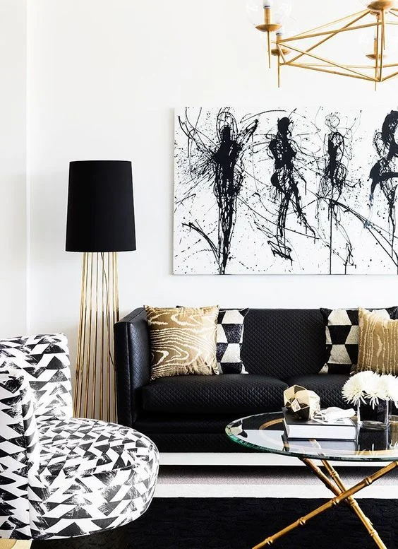 I like the old brass & gold coloured accents in this room. They are great companions for black and white. Source: House of Pondo