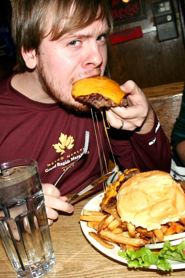 The first bite. A look of uncertainty. Note the marathon shirt that I'm wearing: another test of endurance here, one that I will fail.