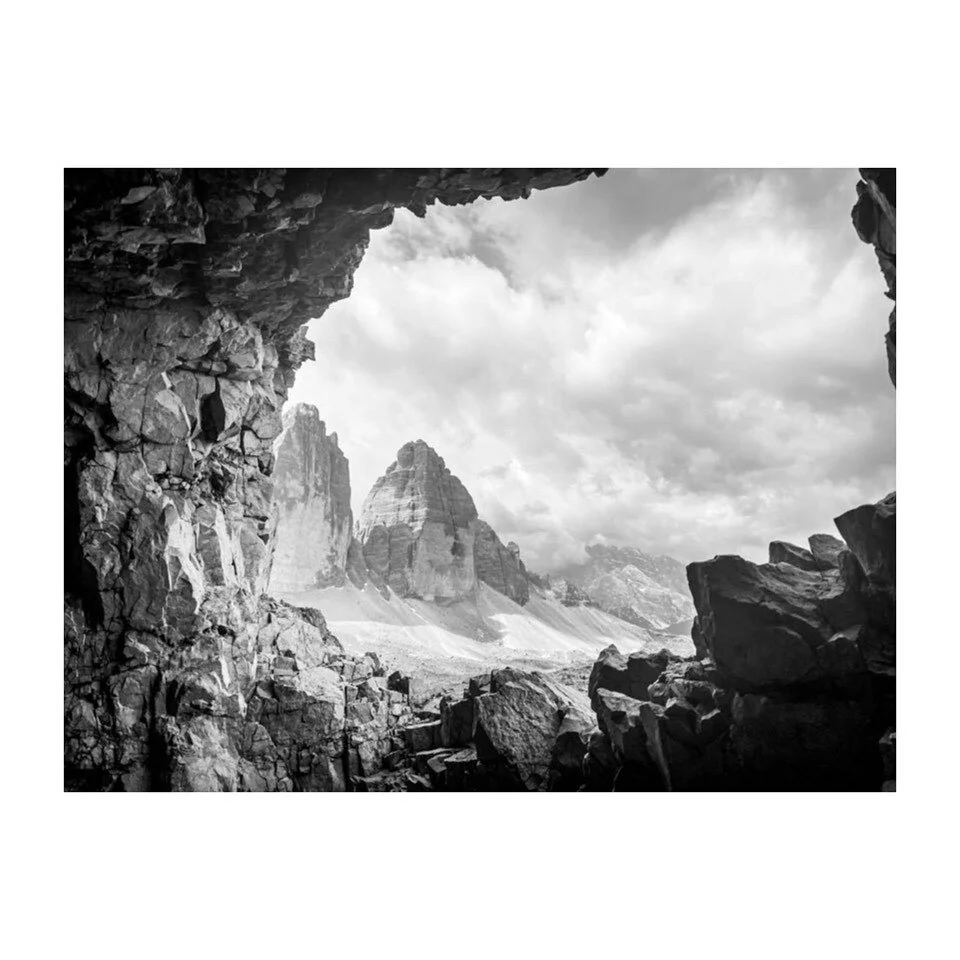 B&W Collection // DOLOMITES 
2023July
The view from inside tunnels bored by solders during WWI. The Italians holding off the Austrians advancing up the valley. While on the via ferrata we crouched down to peek the Tre Cime Di Lavaredo, south fac