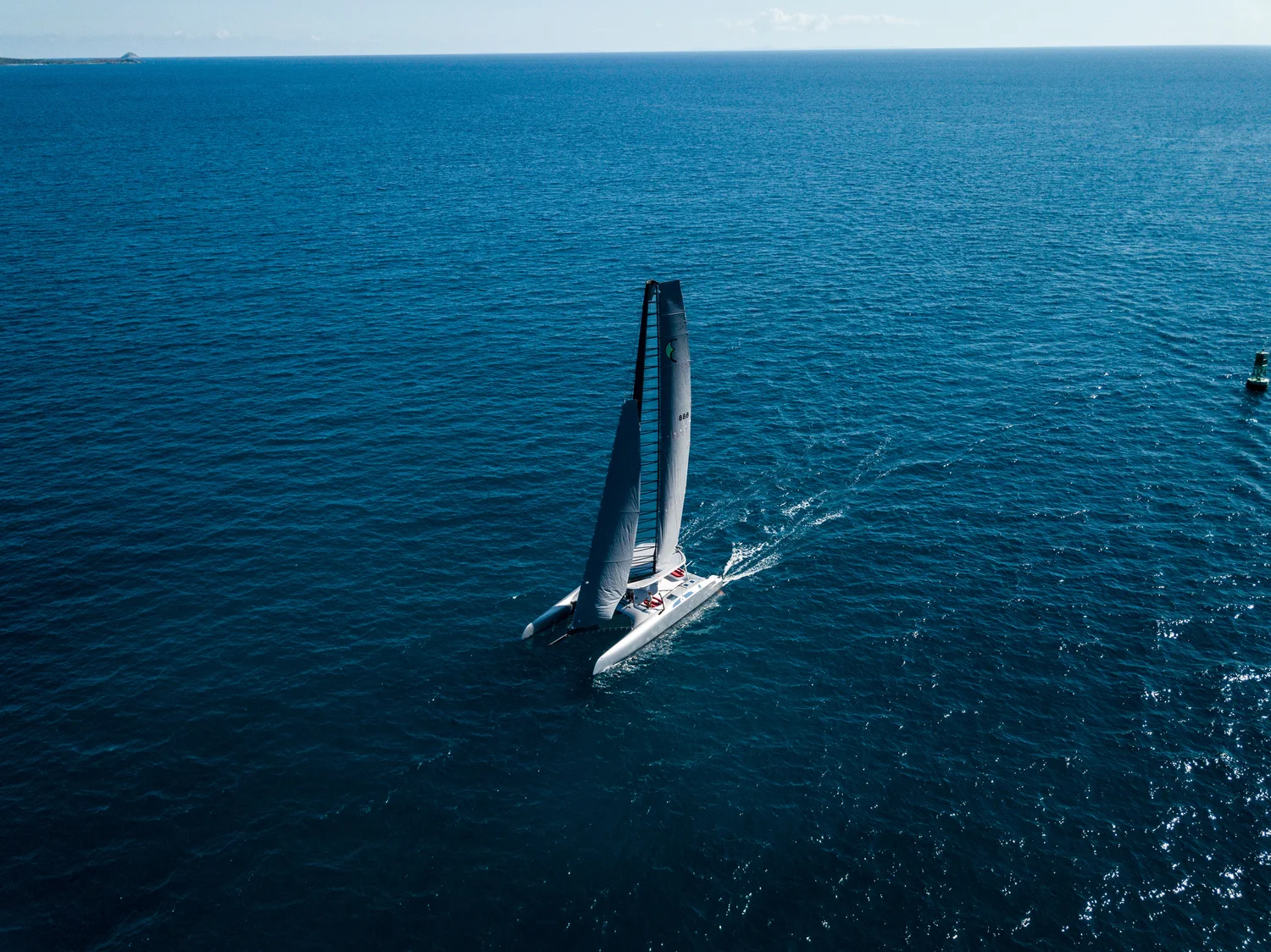 Eagle Class 53 sailing on deep blue water, aerial view
