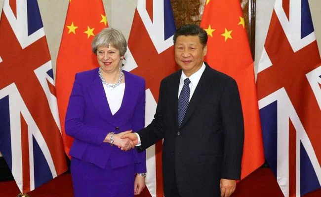 theresa-may-xi-jinping-reuters_650x400_81517557019.jpg
