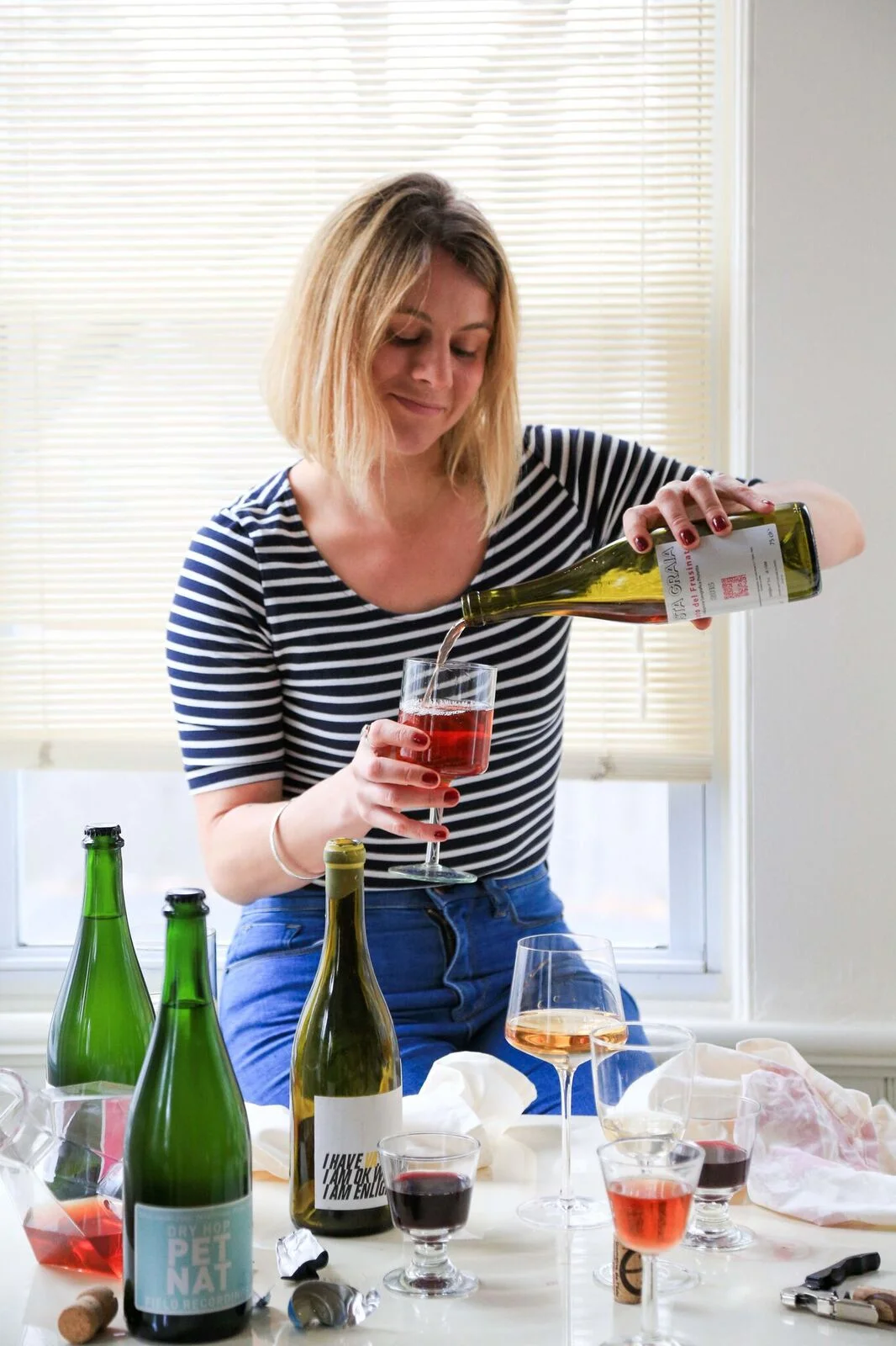 Rachel Signer bio shot_pouring wine.jpg