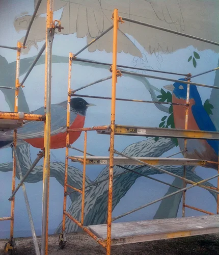 The artists worked on scaffolding to reach the high areas.