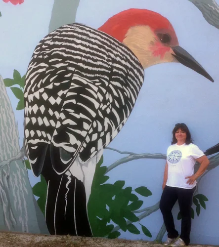 Carol Makris pictured here with a completed Red-Bellied Woodpecker.