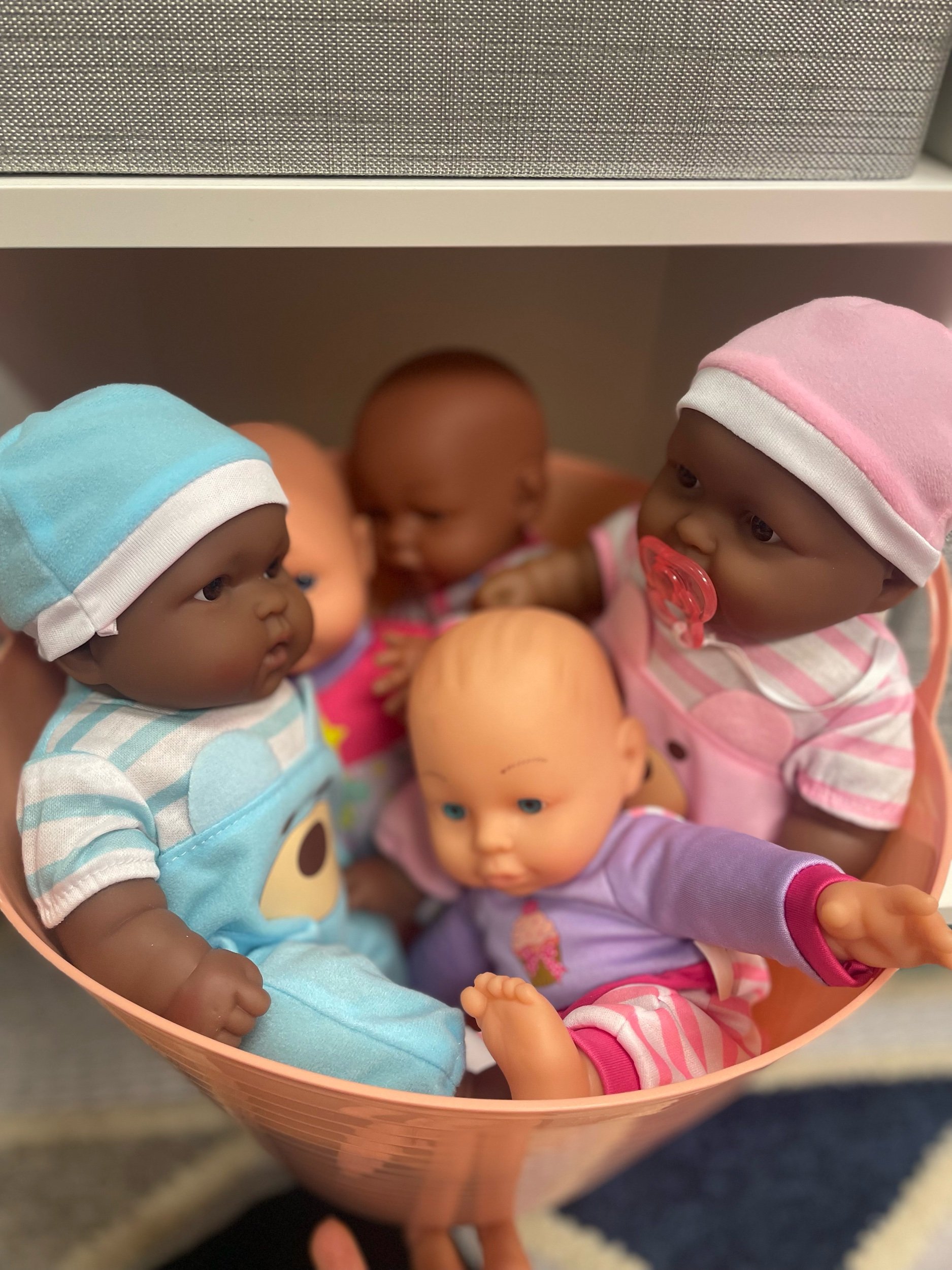  Data about the racial makeup of the children and families using the room guided our choices about baby dolls included in the room.  