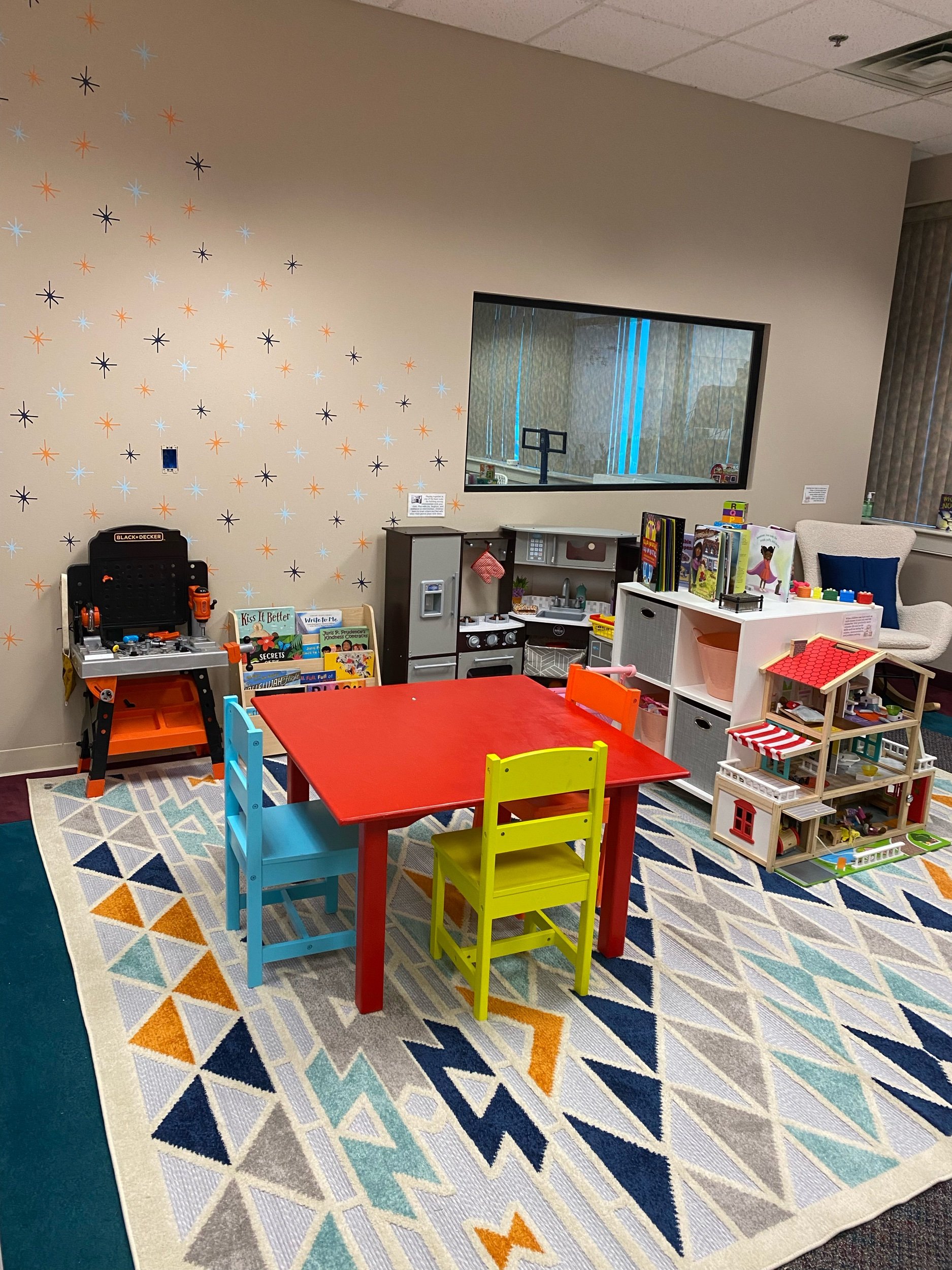  The red table , kitchen set and workbench play set were pieces that the agency wanted to remain in the room. We were able to incorporate them into the design of the room and think it’s important to respect the wishes of the staff who  use the room. 