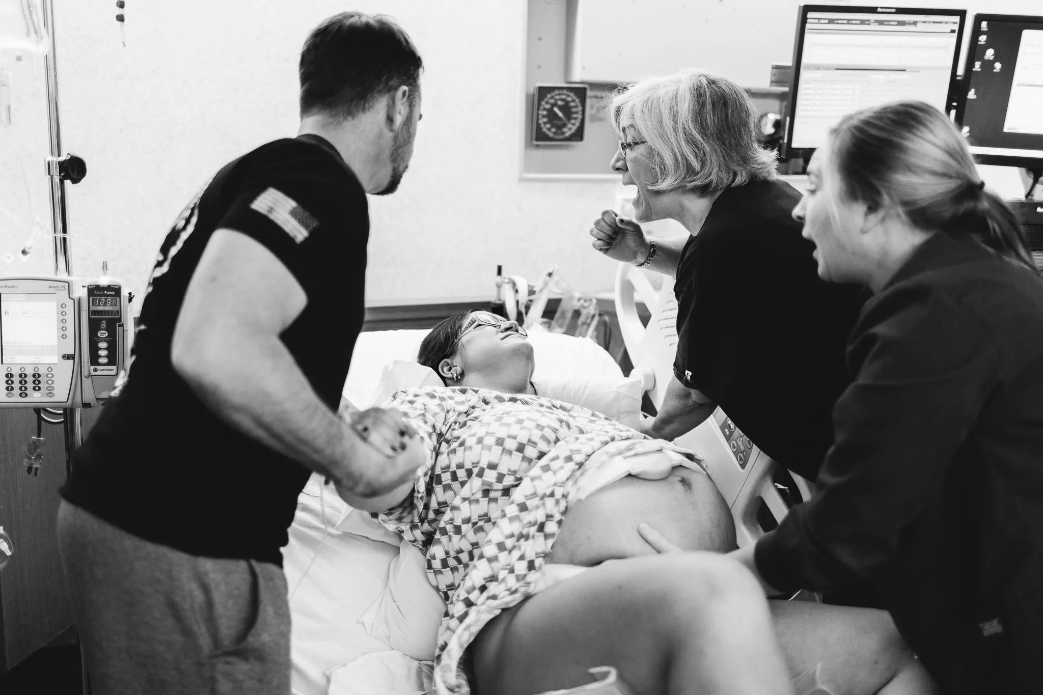 bridgetmassa.com This baby, like her child before, came fast. Mom went from 5m to holding baby in 45 minutes. Every one in the room rallied around mom, as she breathed deeply and knew it was time to start pushing. This was their third child, but the first birth that her military husband was able to be present for. Her mom was there for the birth of all three of her grandbabies. Mom needed both of them there and it was beautiful to witness their strong and supportive love.