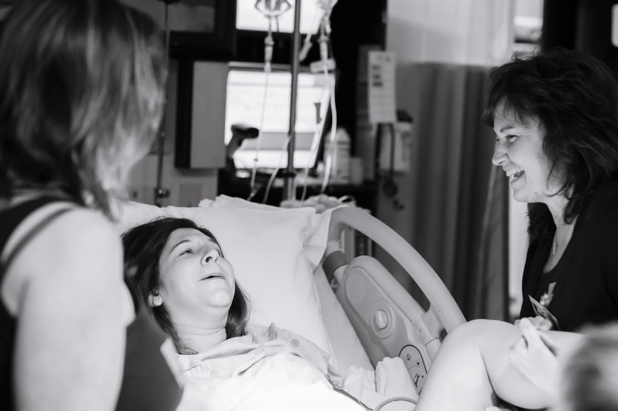 www.jodicarolphotography.com Encouragement and laughter as baby is crowning! There was so much excitement in the room as this Mama and Grandma of two boys were about to meet a baby girl!