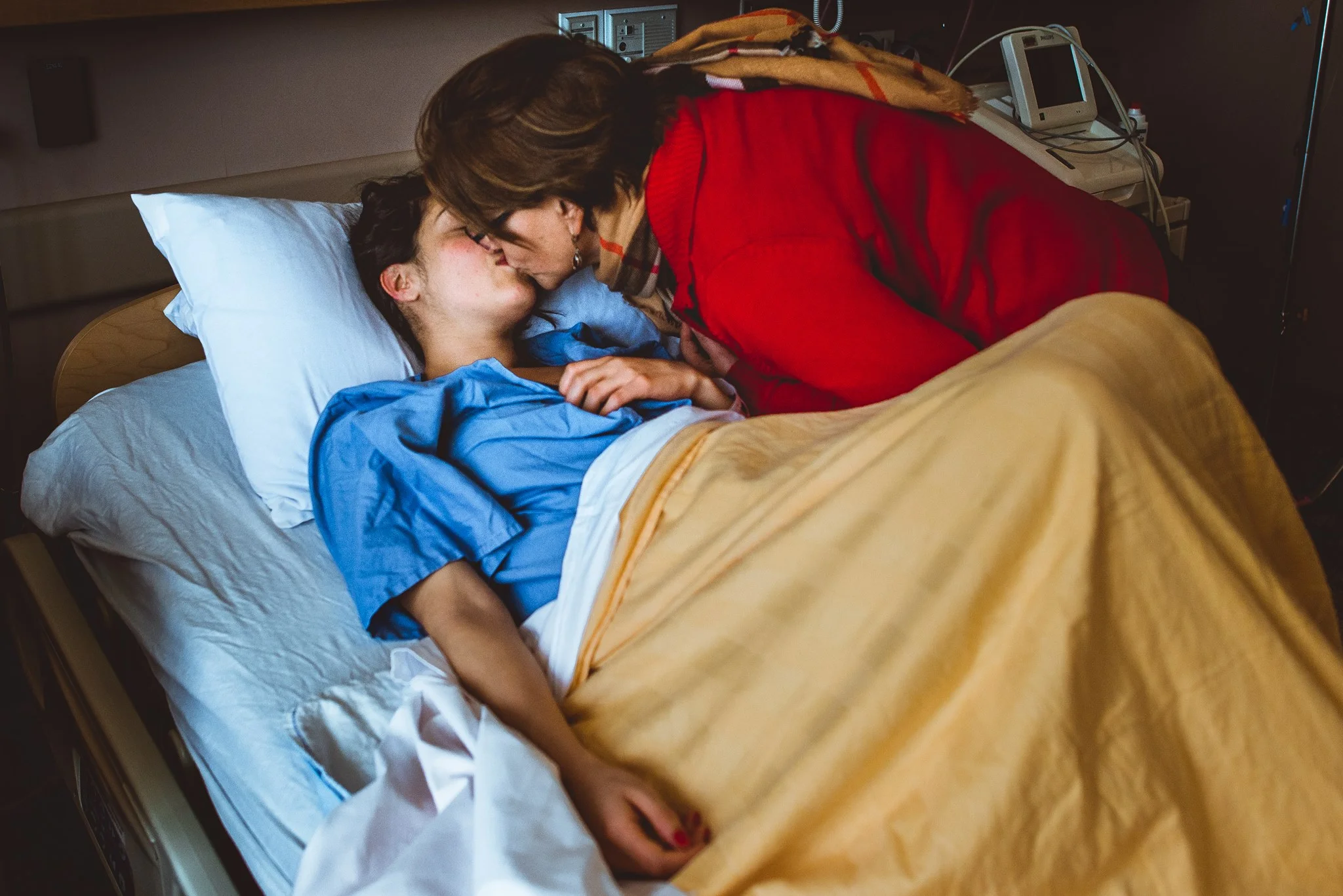 www.ellianagilbert.ca A kiss a mother gives to her only child who just gave birth for the first time.