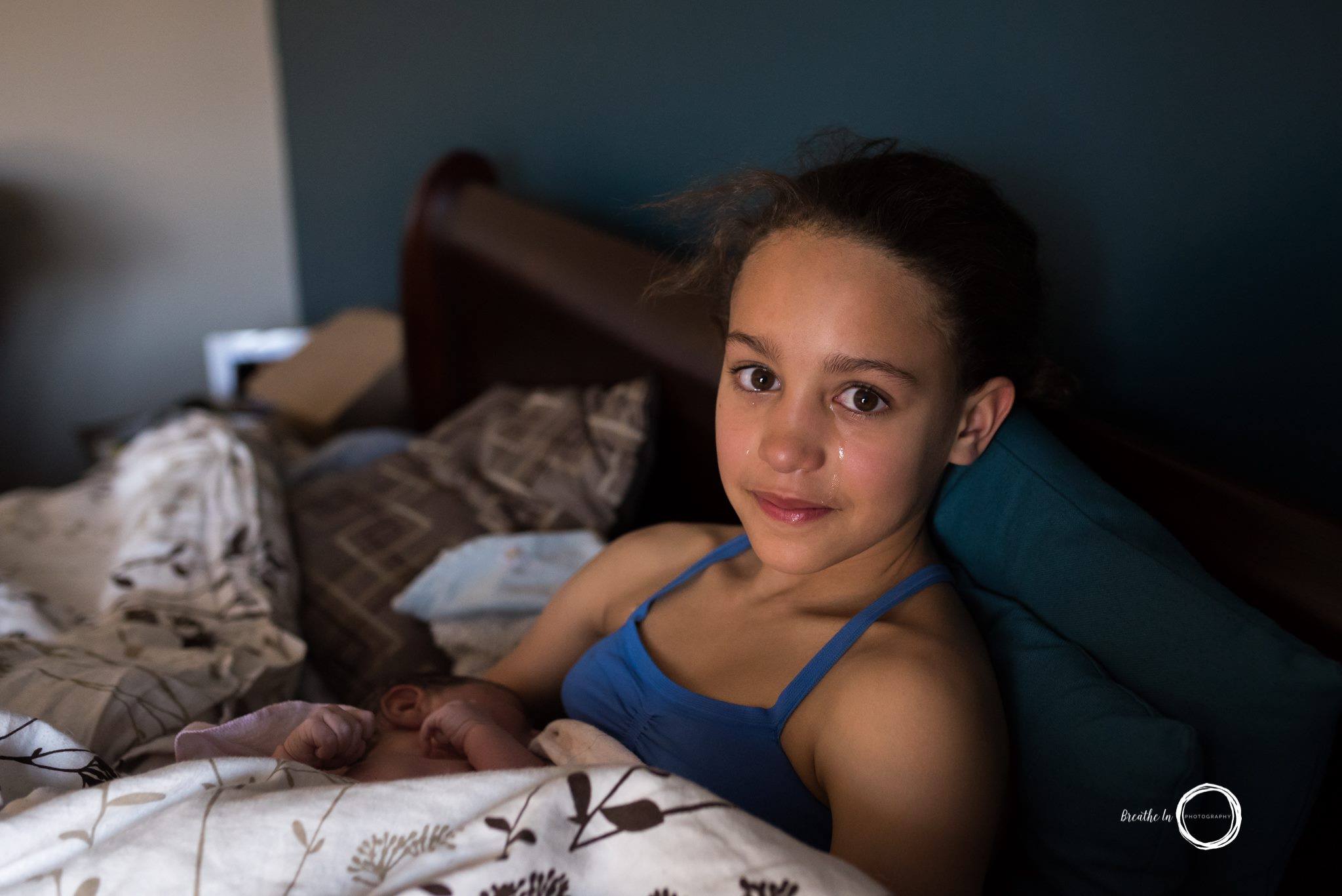 www.breatheinphotography.ca Oldest sister holding her newborn baby brother. 