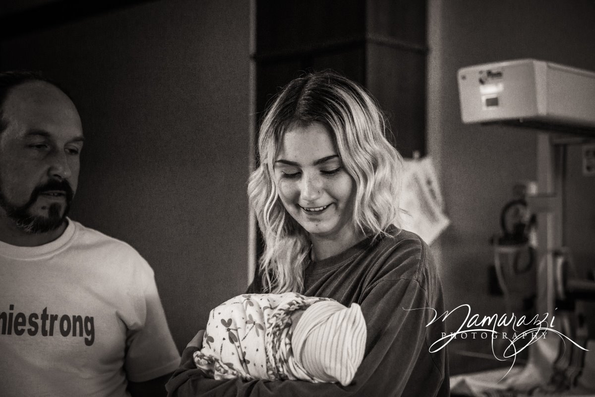 www.jhmamarazziphotography.com There's a bit of an age gap, but this big sister was excited to hold her baby sister for the first time.