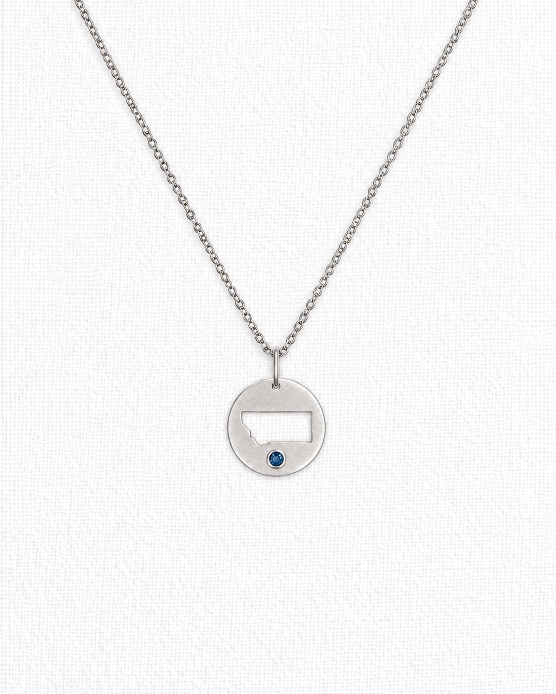 Montana Sapphire Cutout Circle Pendant.jpg