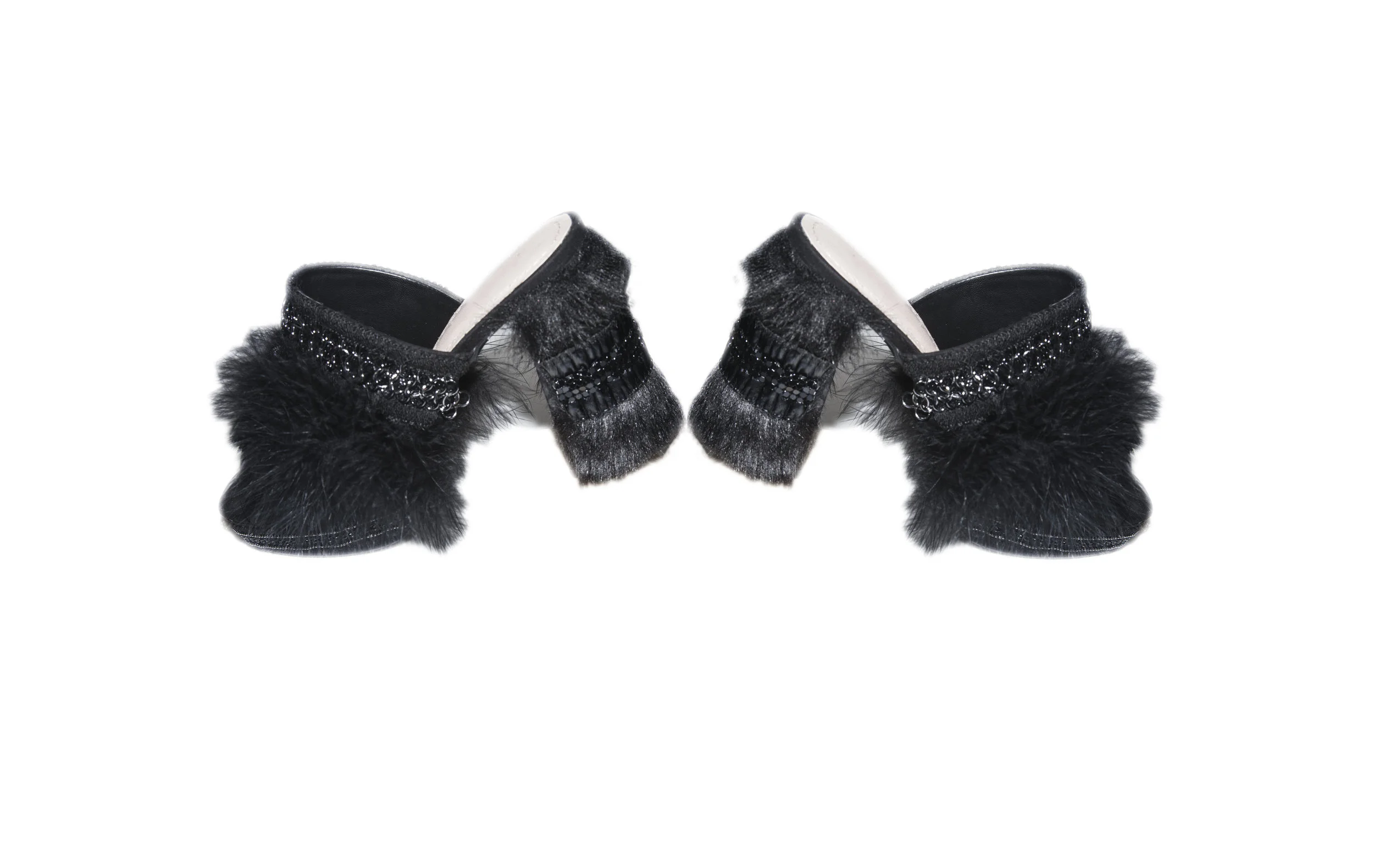 In need of evening shoes, San Martin added fur, feathers and embroidery to decorate these store bought heels after being invited to a last minute event.