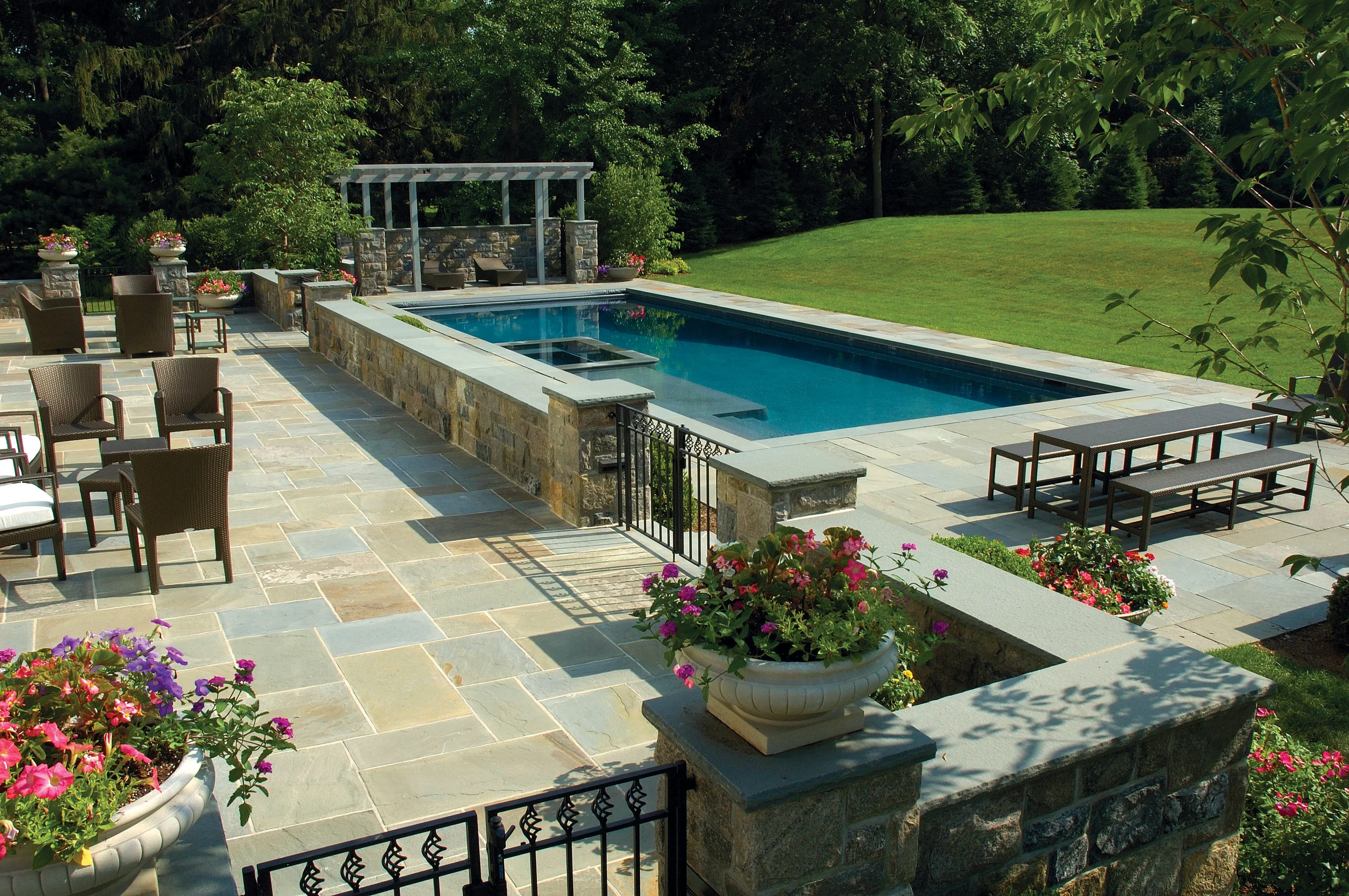 MATERIALS USED: FULL RANGE, NATURAL CLEFT BLUESTONE PATIO; CT FIELDSTONE, SQUARE CUT WALLS; BLUE, THERMAL BLUESTONE WALL CAPS