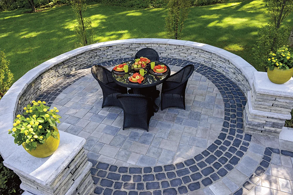 MATERIALS USED: UNILOCK CONCRETE PAVERS; RICHCLIFF PATIO, COURTSTONE BANDING AND RIVERCREST WALLS