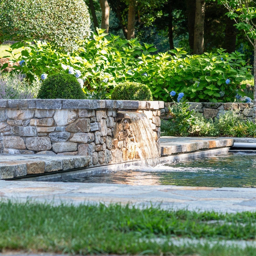 Take your poolside retreat to new levels with the addition of a water feature.

#outdoorliving #naturalstone #masonry #stonework #houseandhome #housedesign #homedesign #fairfieldcountydesign #designinspiration #mynewengland #homeowner #connecticut #C