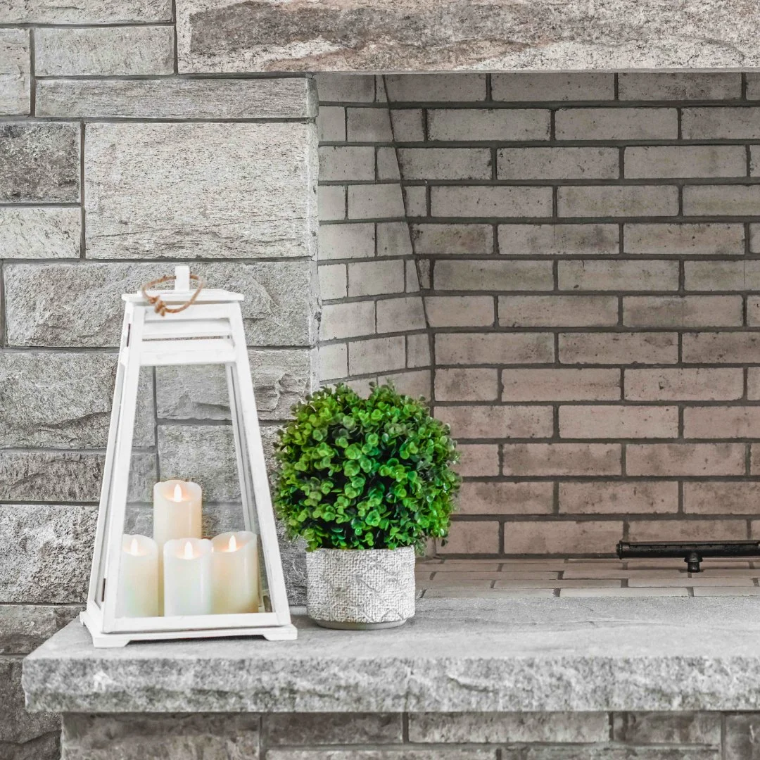 The perfect spot to gather as the temperatures are low. This beautifully crafted Imperial Grey fireplace adds warmth and character to every cozy moment.