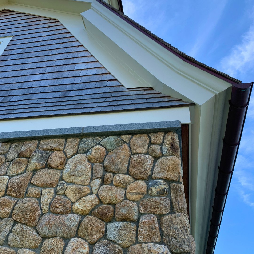 Looking up, the natural warmth of native fieldstone stands strong against December&rsquo;s chill - a perfect blend of enduring craftsmanship and organic beauty.