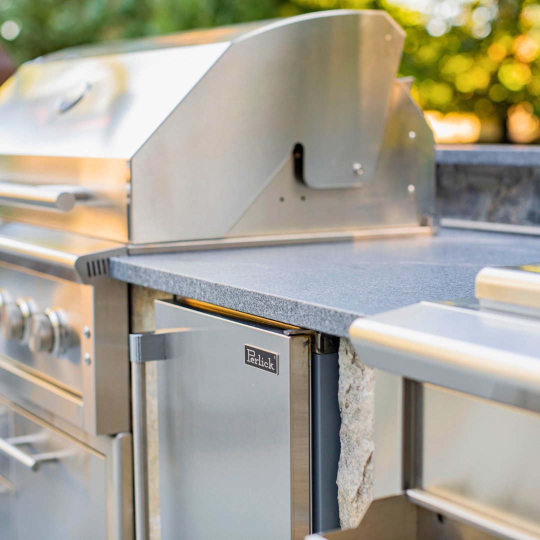 Kick off the year with a backyard upgrade! This honed Newport Dark countertop on a fieldstone base is perfect for winter prep and summer entertaining.