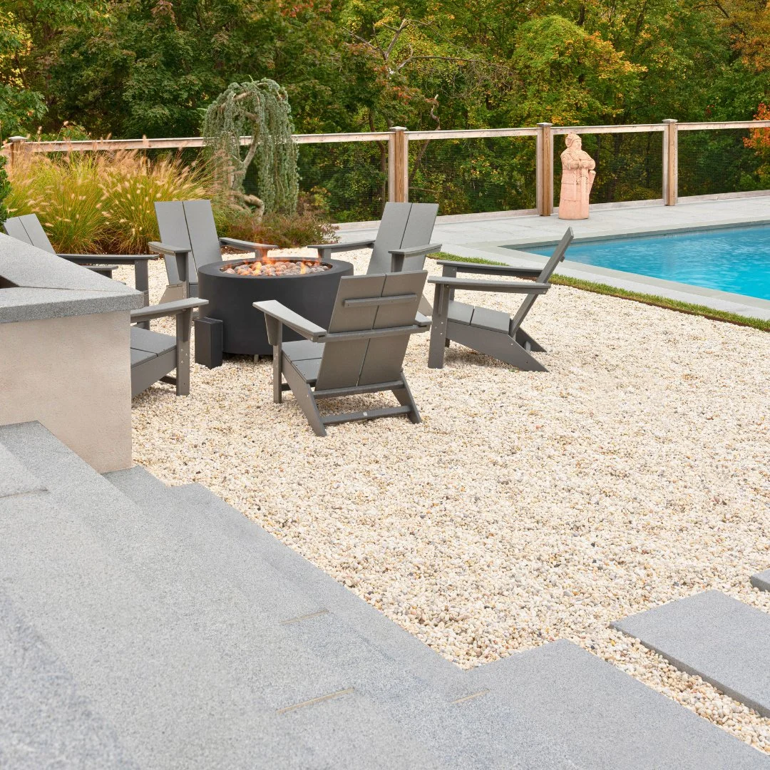 Start the year warm and welcoming. A Newport Dark pool patio and firepit surrounded by NJ Pea Stone creates the perfect backyard retreat.