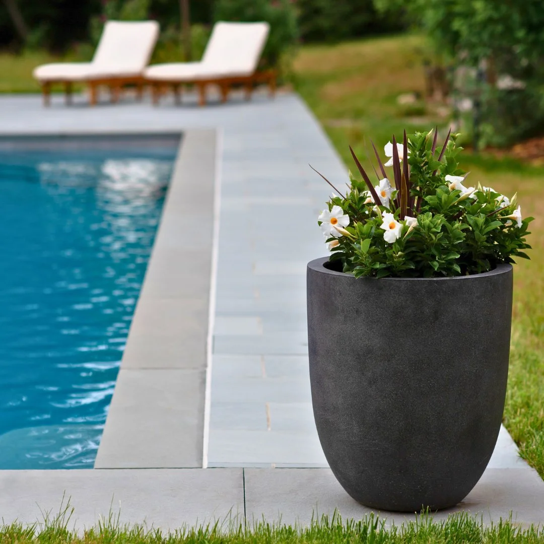 Celebrating National Pool Opening Day in style!
A close-up of a Thermal Bluestone coping, set against our Riverside Bluestone Porcelain patio and lounge chairs, ready for relaxation. Simple details, natural materials, and a space built for enjoying t